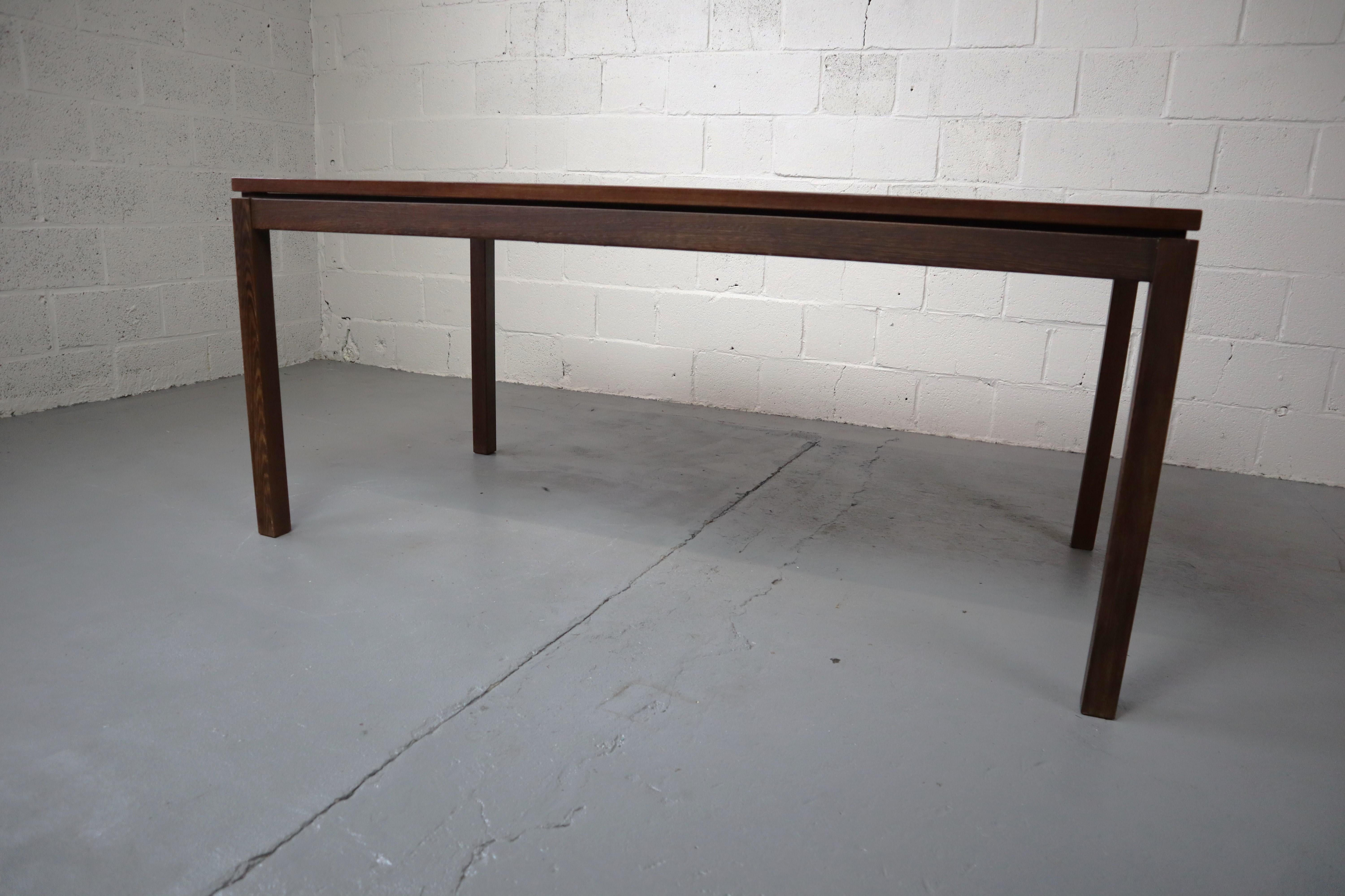 Beautiful wengé dining table with rectangular wengé veneered top. The base consist of four legs of solid wengé.
This design has straight and distinct lines.
The table is extendable to 223cm.

Entire Wengé dining room set available! Chairs,