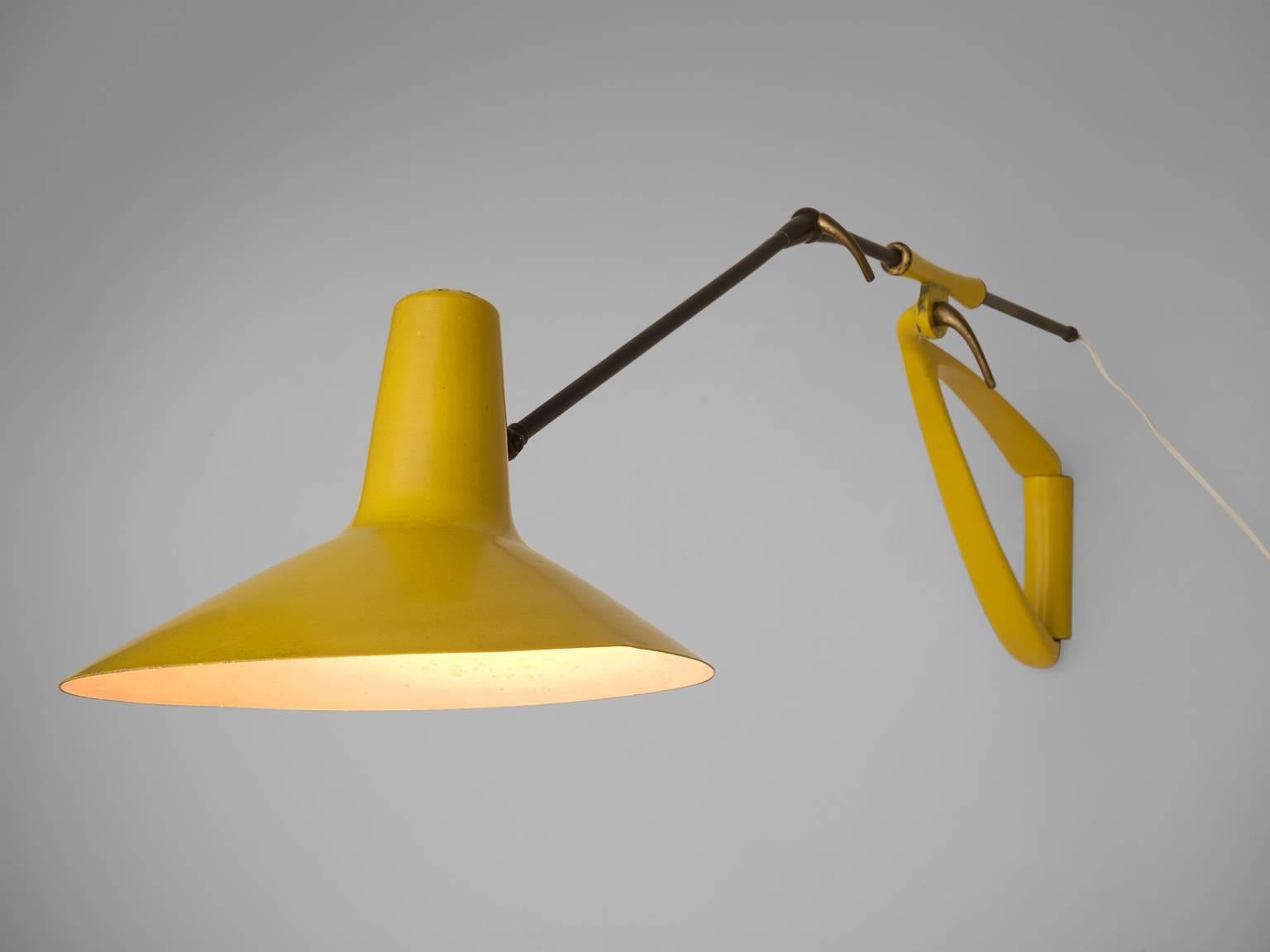 Stilnovo (attributed), wall light, yellow metal and brass, Italy, 1950s

This beautiful deep yellow lamp is executed in lacquered metal and solid brass. The key to the beauty of this lamp is in the open detailed of the arm and the delicate shape of