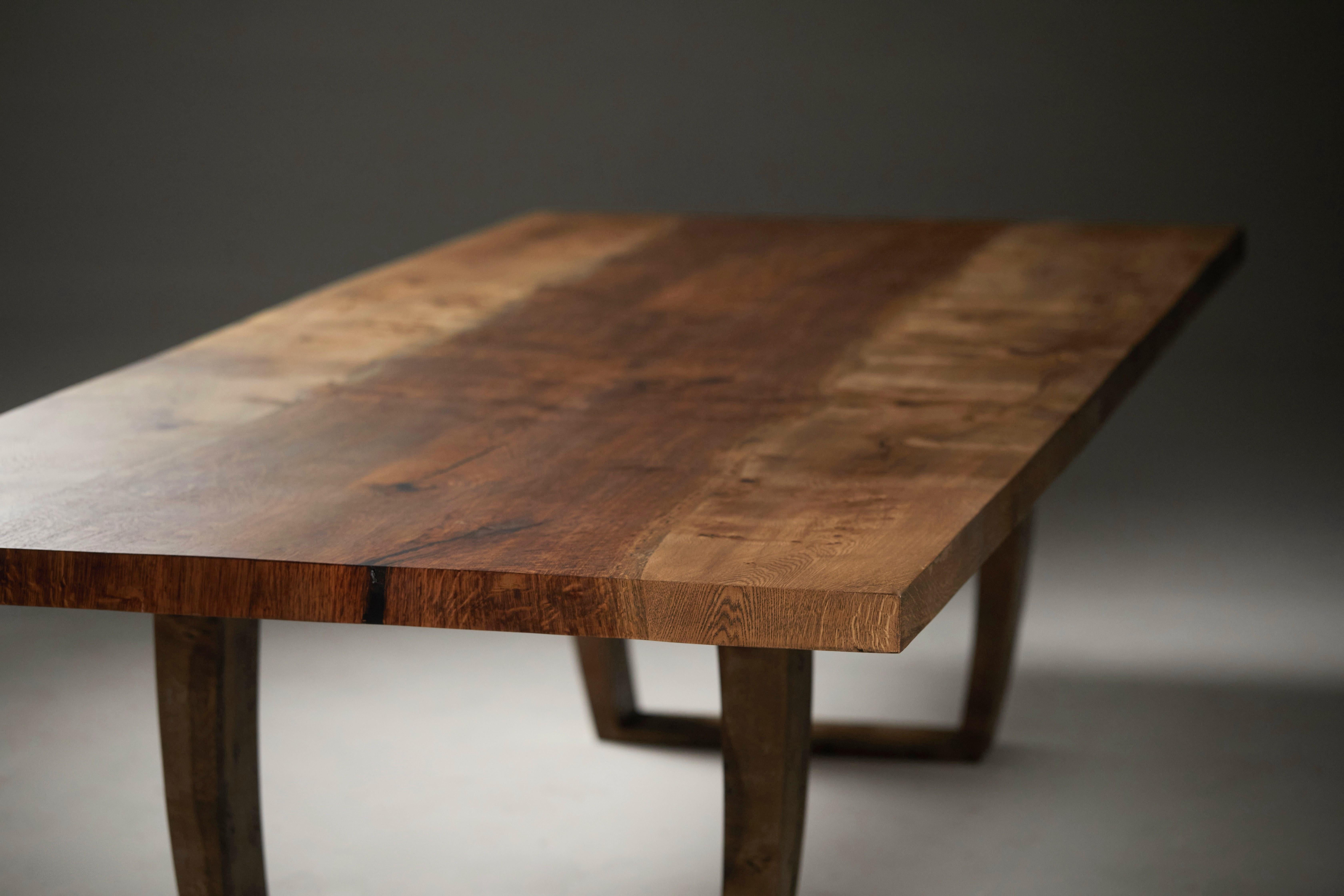 British Extendable oak table with central live edge brown oak by Jonathan Field For Sale