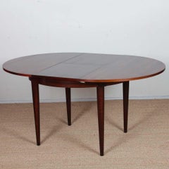 Extendable rosewood dining table in Rio, 1960