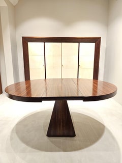 Extendable round dining table in rosewood by Vittorio INTROINI