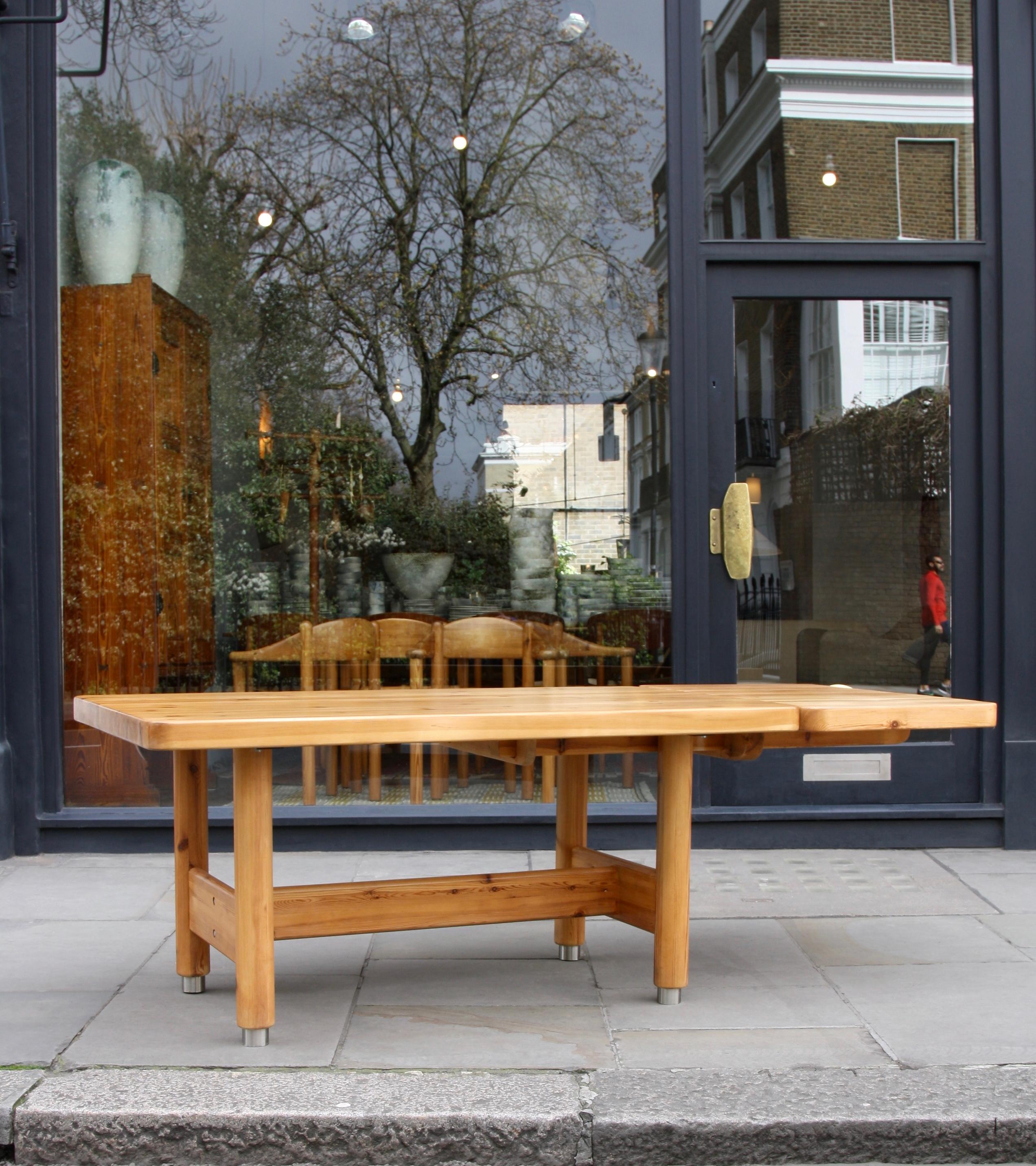An extendable solid pine table designed and made by Danish architects Knud Friis & Elmar Moltke Nielsen in the 1950s.
Although made of solid wood and being impressive in size and proportions the table has a visual lightness and playfulness. This