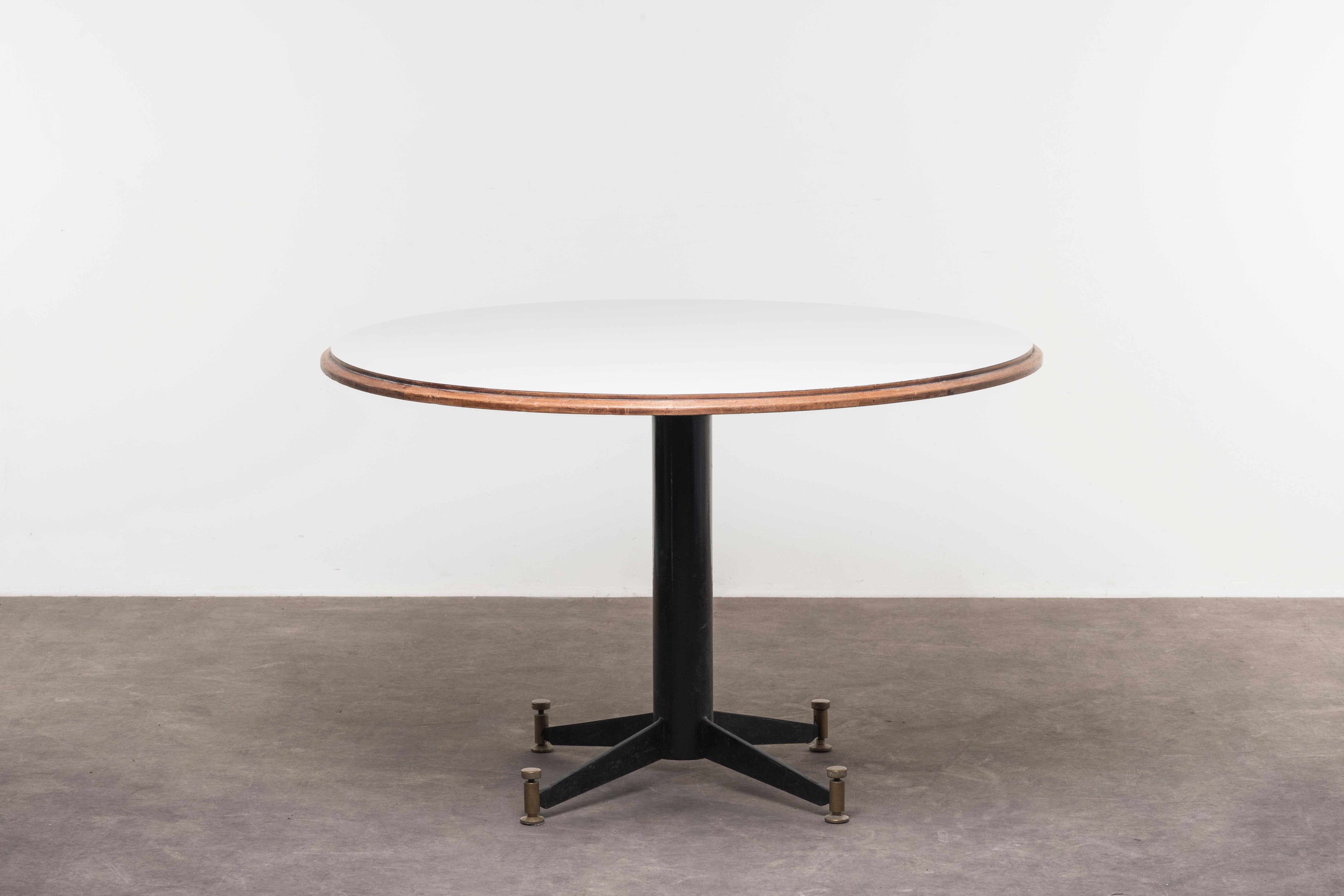 Table by Gastone Rinaldi. Italy, 1956. Manufactured by Rima. Metal base, brass legs, wooden and white formica top. Measures: D 116 x H 76.5 cm - D 45.7 x H 30.1 in extendable up to 252 x 142.5 cm - 99.2 x 56.1 in.

 