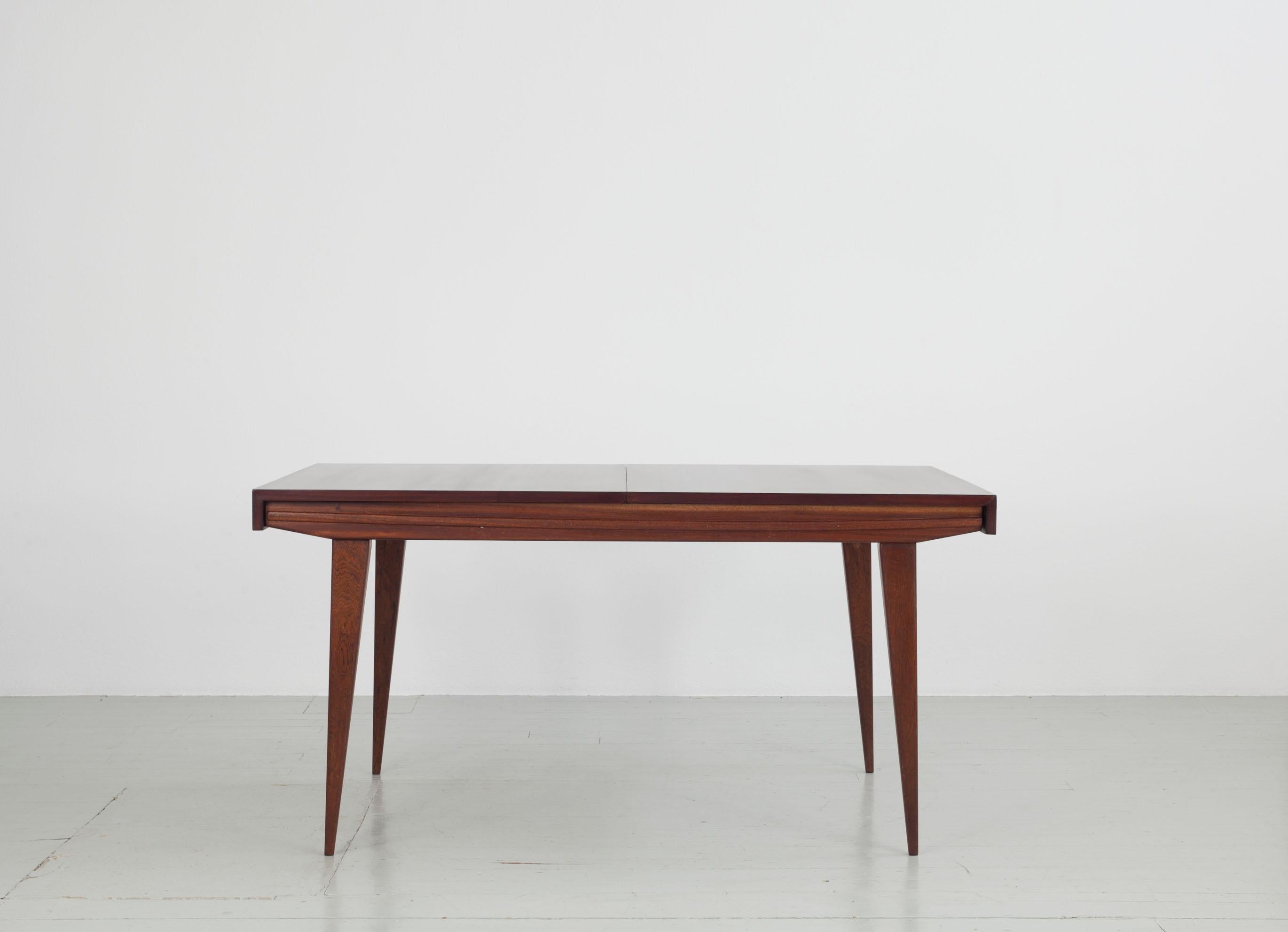Extendable dinning table by Maurice Pré, designed in France in the 1950s.