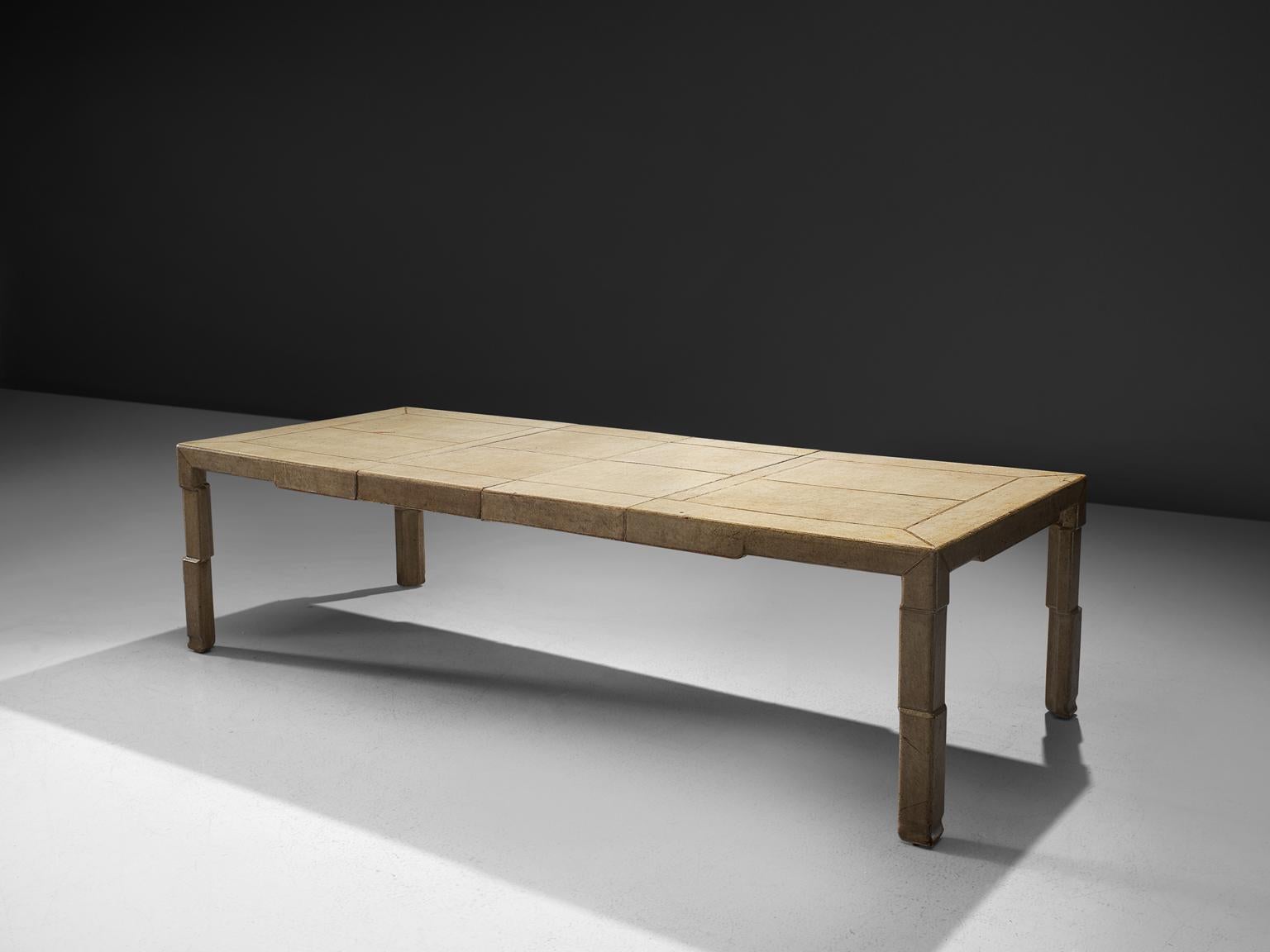 Extendable table, goatskin, Italy, 1930s

This Italian extendable table from the 1930s is unique in its form and in the use of material. The table is made of goatskin. The legs of the table have the illusion being build up from cubes, giving this