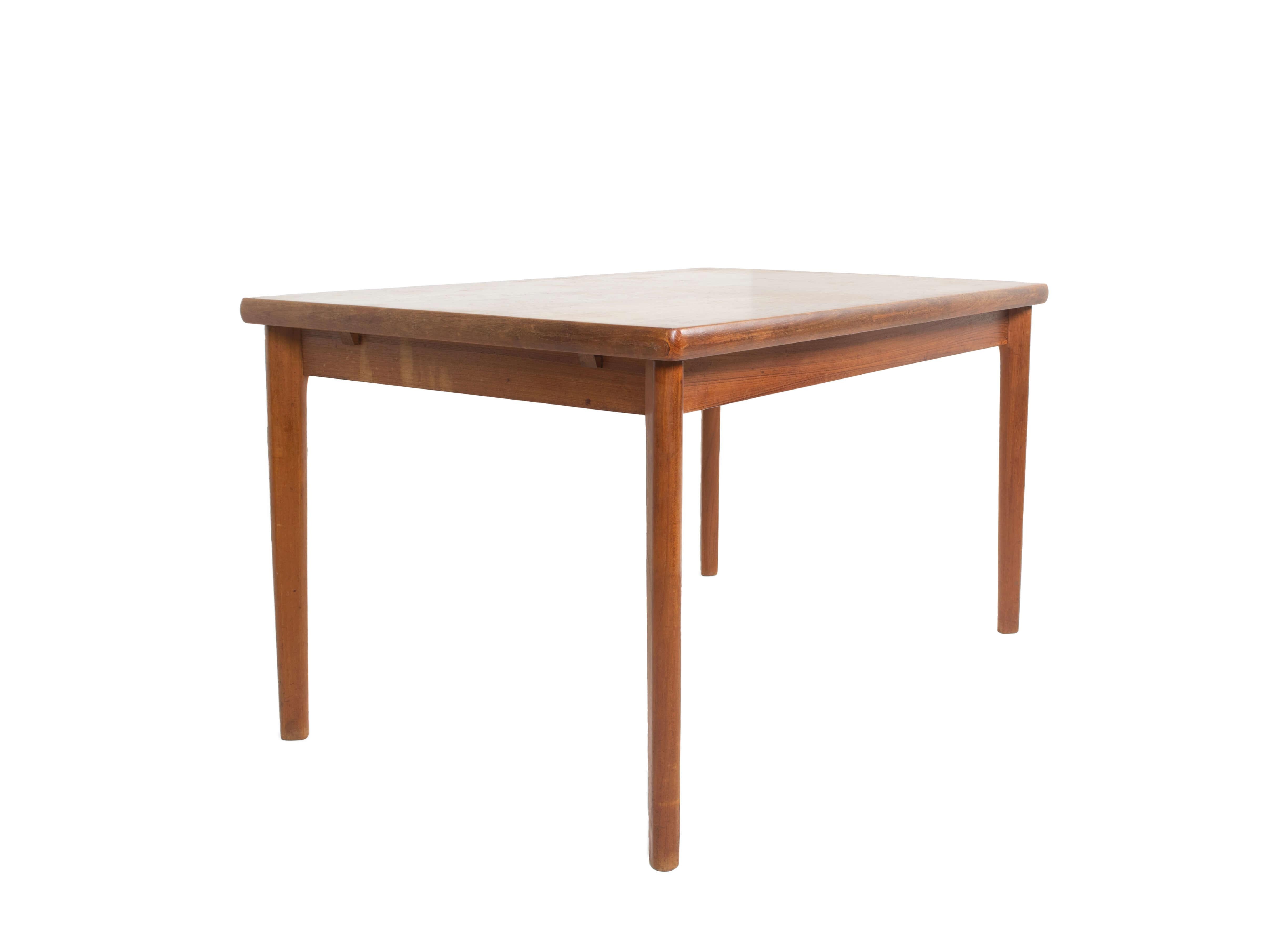 Nice extendable teak dining table by Henning Kjaernulr for Vejle Stole & Mobelfabrik, Denmark, 1960s. The table has a minimalistic design with easy and good functioning extension. The top can be removed where the two extensions are hidden and can