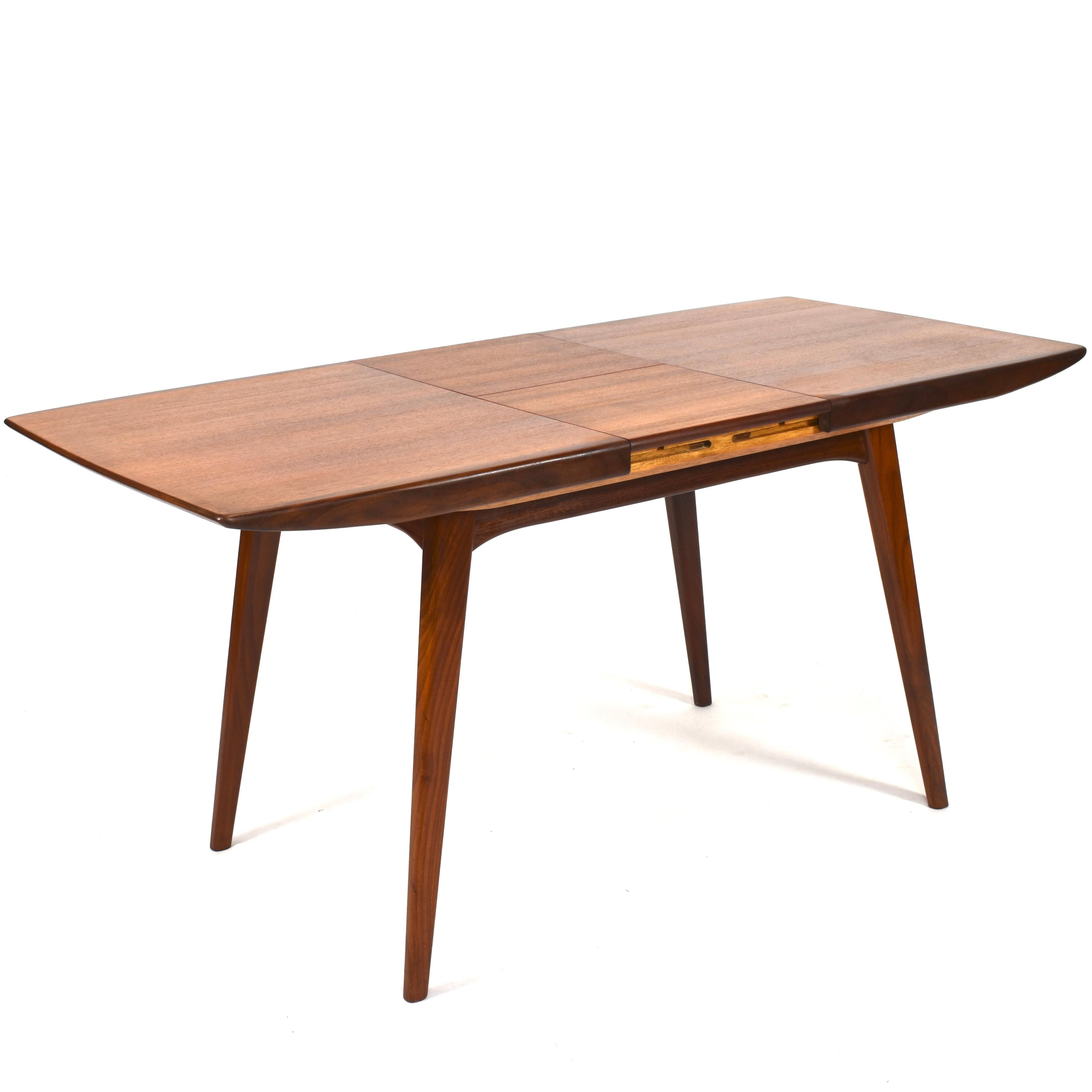 Fold-out dining table by Louis van Teeffelen for WeBe - The Netherlands, circa 1950.

Designer: Louis Van Teeffelen.

Manufacturer: WéBé, Walraven & Bevers.

Country: Netherlands.

Model: Extendable dining table.

Material: Teak (solid