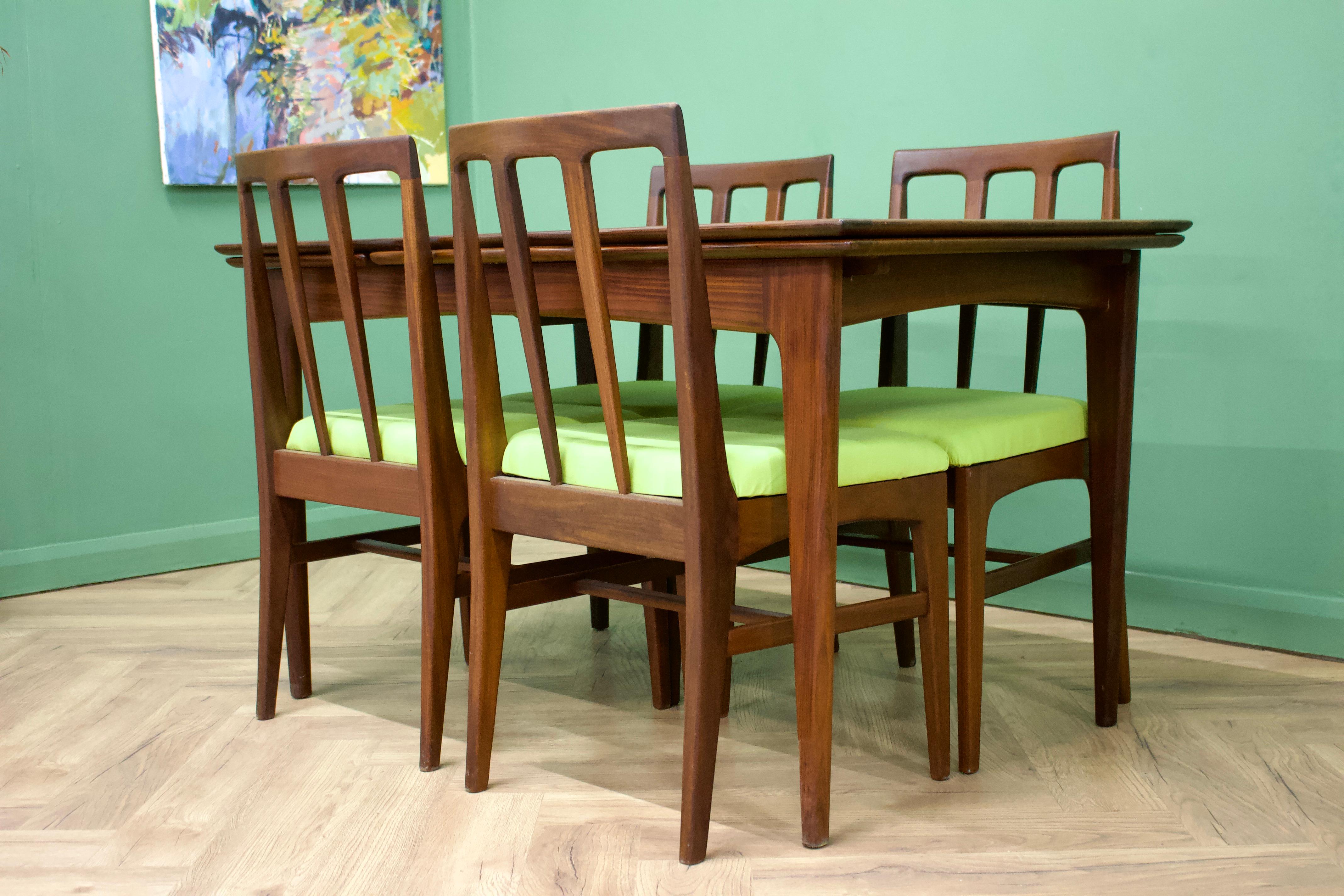 - Mid century extending dining table and 4 dining chairs.
- Made in the UK by Younger.
- Made from teak and teak veneer.
- Extended width 210cm.