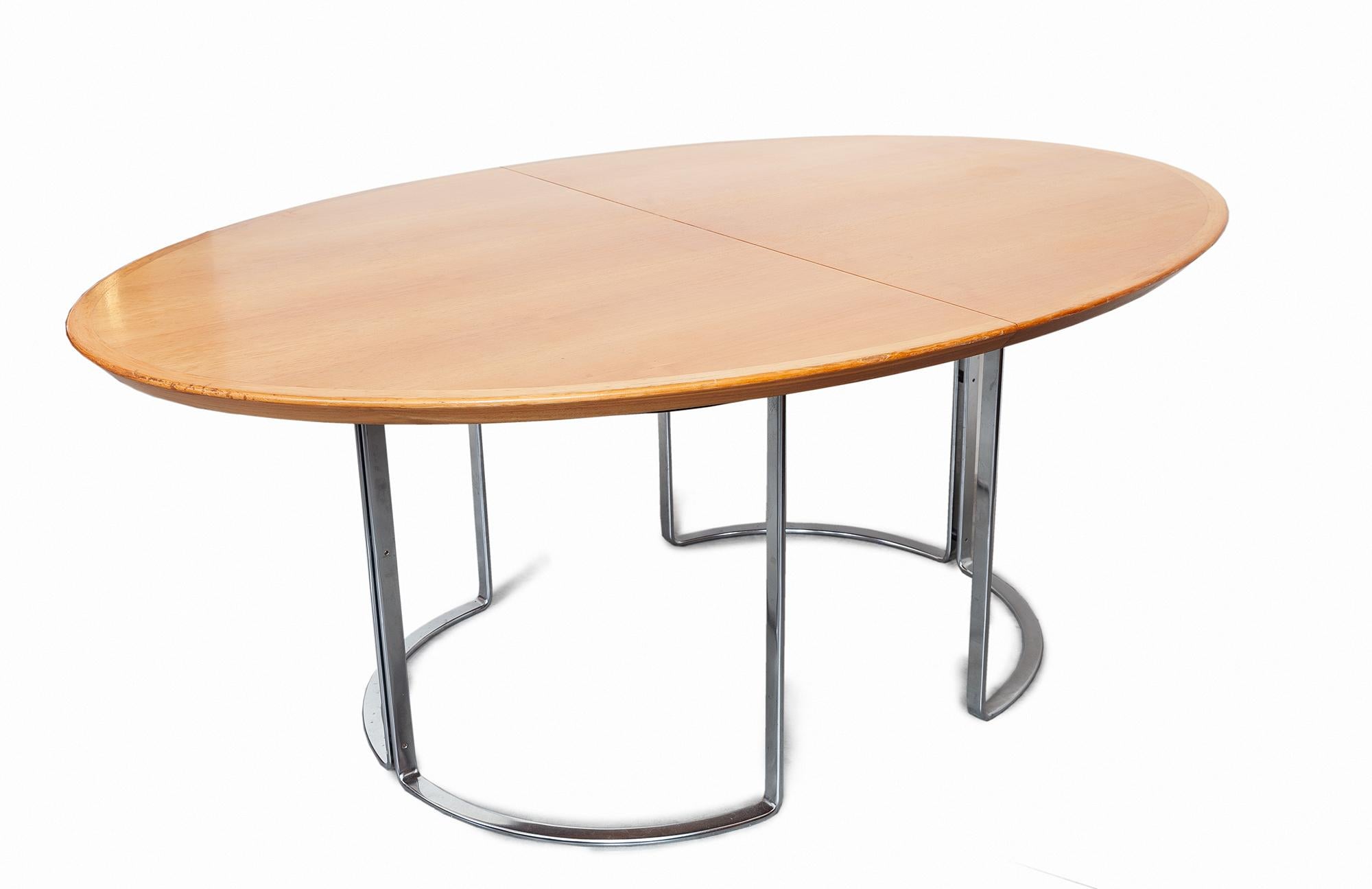 Extendable dining or conference table by Horst Brüning, Germany, 1970s.This is truly a stunning table with many options, there are two walnuts contrasting leafs the table can be extended to 3 meters it has an oval shape that is preserved with the