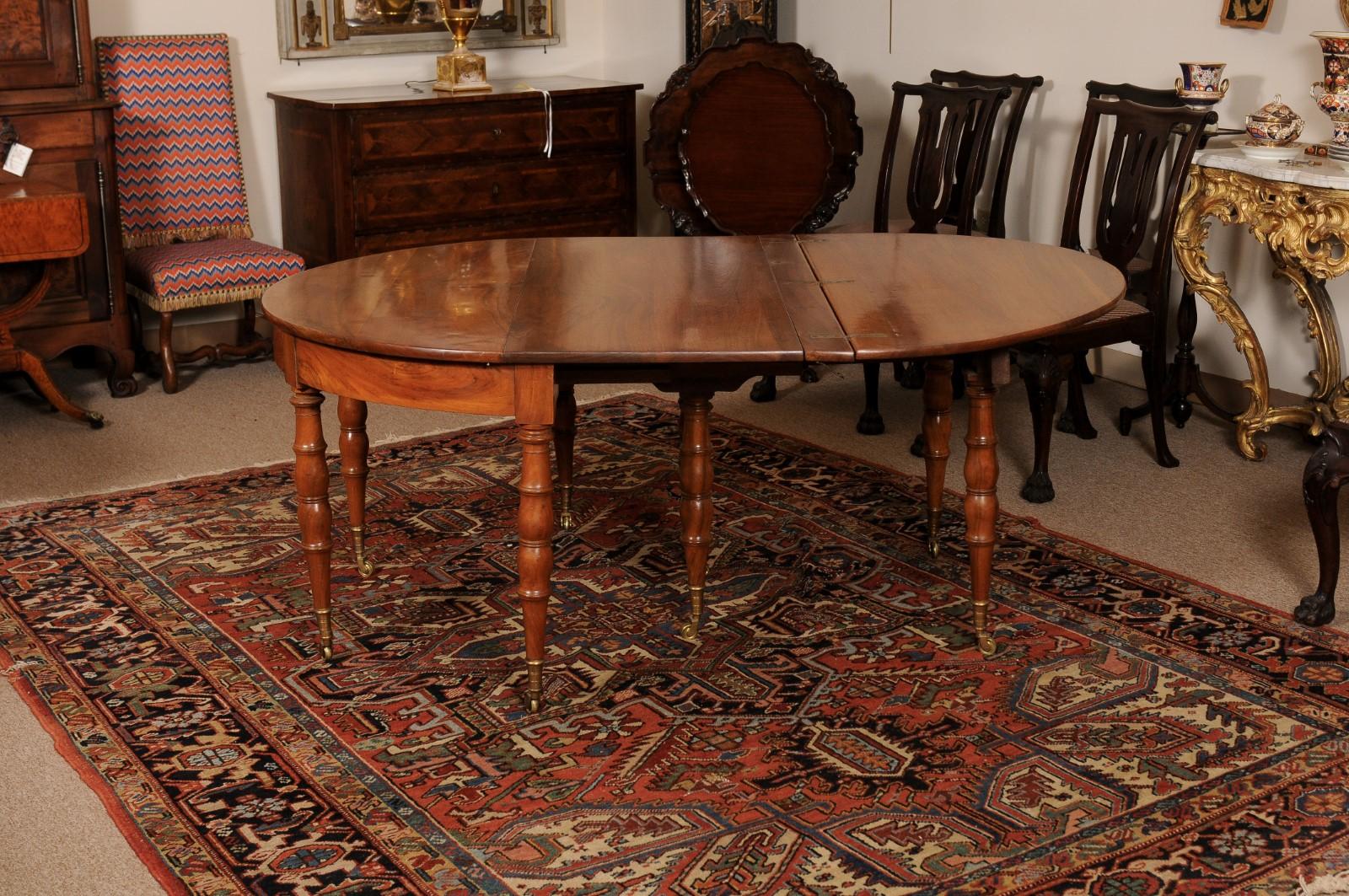 Extending 19th Century French Fruitwood Dining Table w/ 3 Leaves & Brass Castors For Sale 8