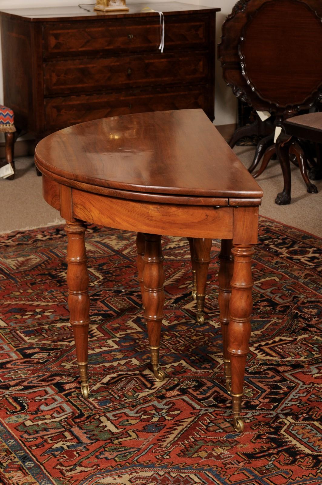 Extending 19th Century French Fruitwood Dining Table w/ 3 Leaves & Brass Castors For Sale 9
