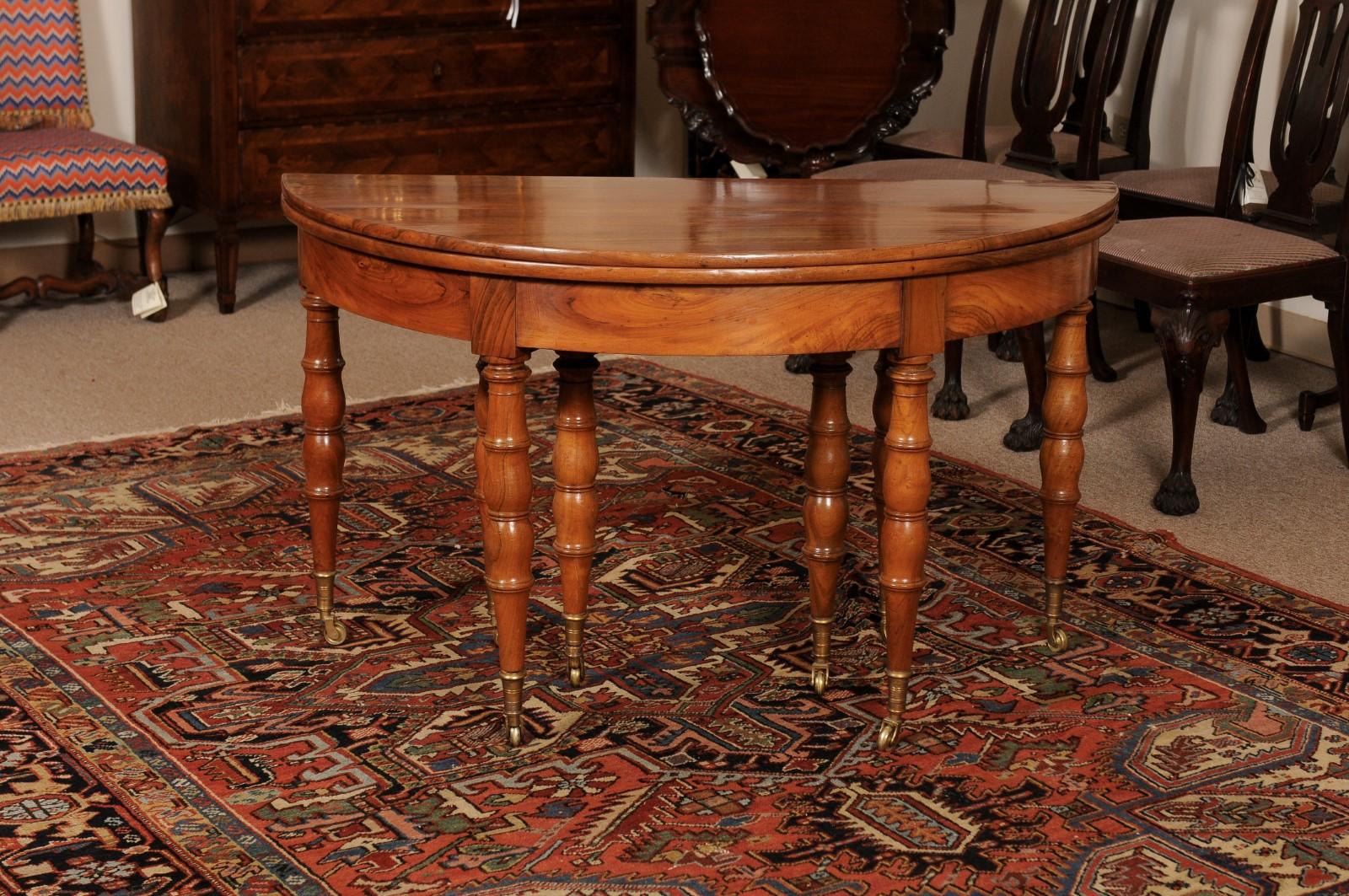 Extending 19th Century French Fruitwood Dining Table w/ 3 Leaves & Brass Castors For Sale 10