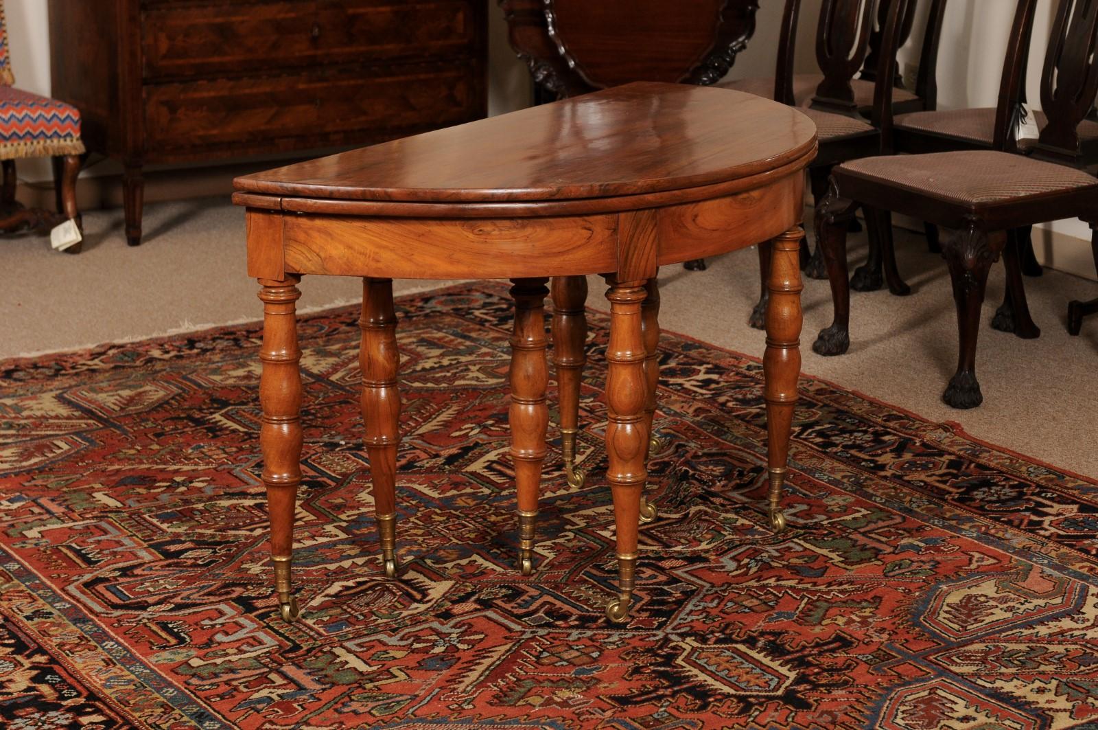 Extending 19th Century French Fruitwood Dining Table w/ 3 Leaves & Brass Castors For Sale 11