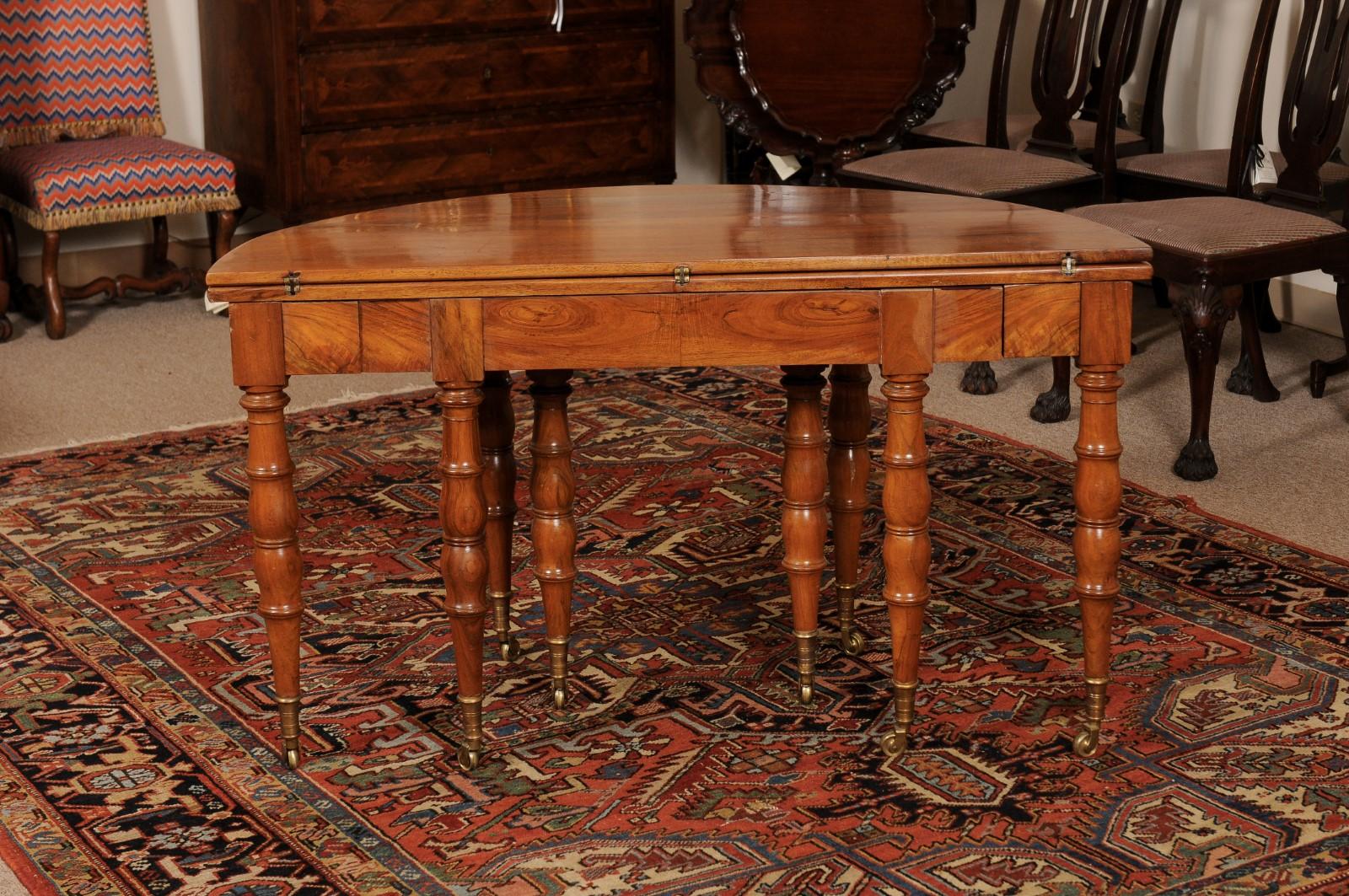Extending 19th Century French Fruitwood Dining Table w/ 3 Leaves & Brass Castors For Sale 12