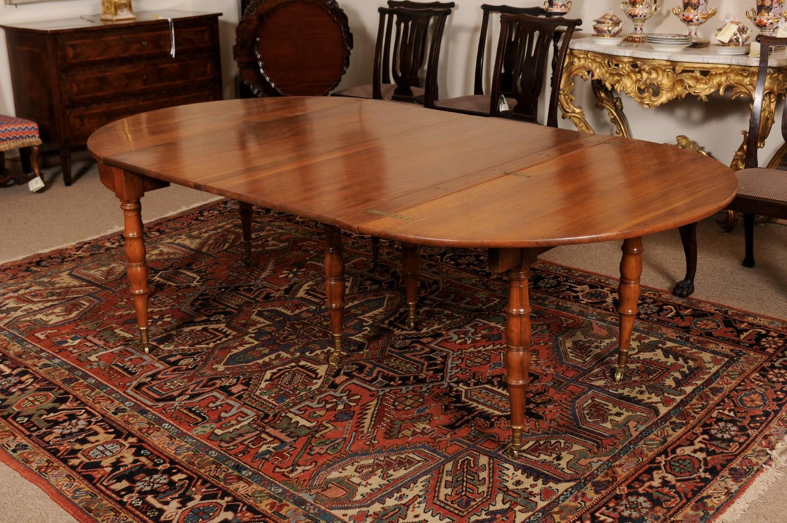 Extending 19th Century French Fruitwood Dining Table w/ 3 Leaves & Brass Castors For Sale 3