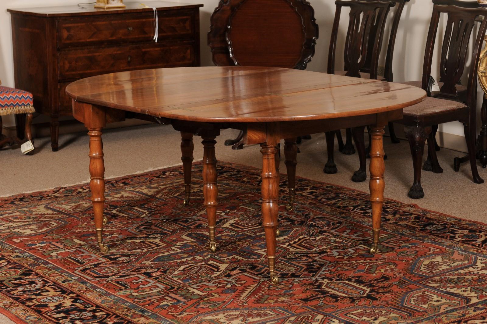 Extending 19th Century French Fruitwood Dining Table w/ 3 Leaves & Brass Castors For Sale 5