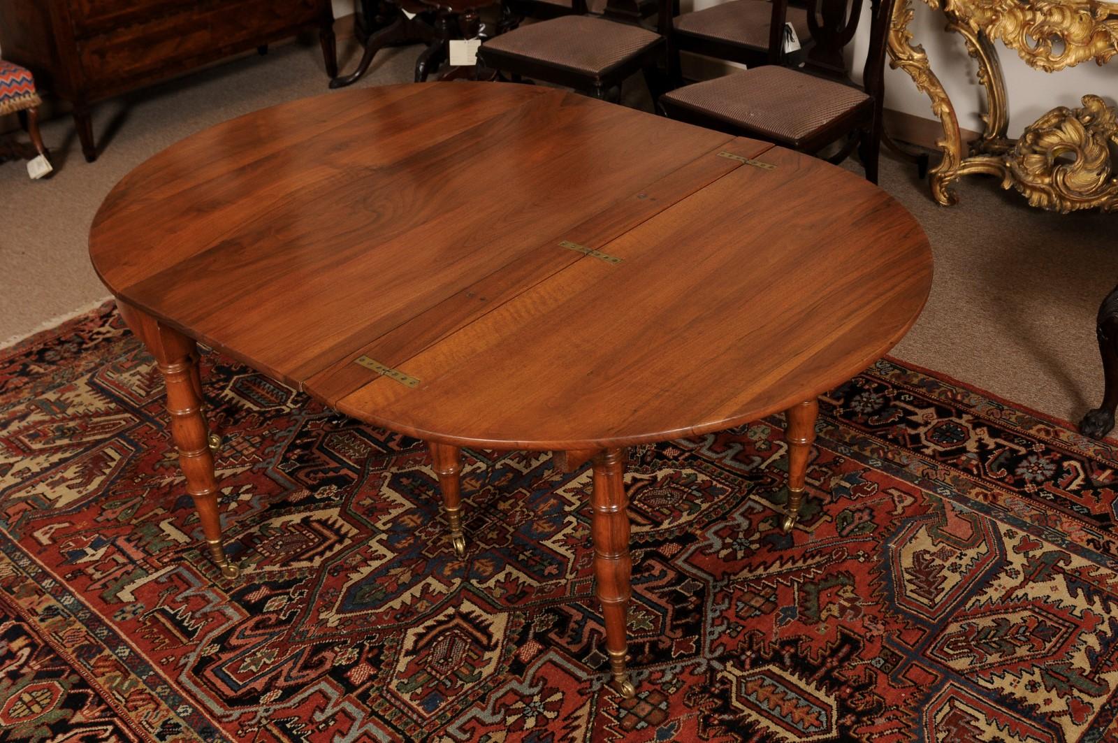 Extending 19th Century French Fruitwood Dining Table w/ 3 Leaves & Brass Castors For Sale 6