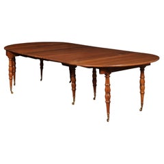 Extending 19th Century French Fruitwood Dining Table w/ 3 Leaves & Brass Castors