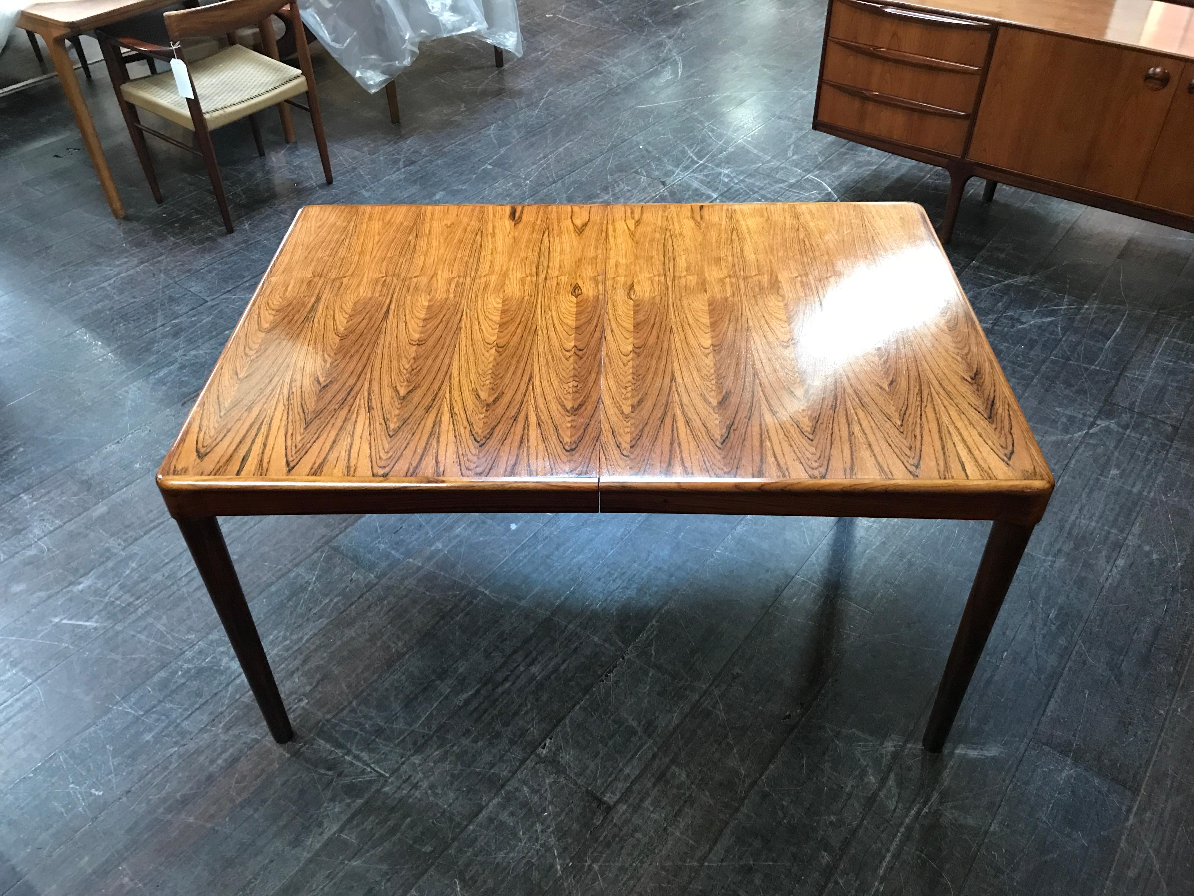 This classic Danish midcentury dining table was designed by H.W. Klein and manufactured by Bramin in the 1960s. Crafted in rosewood, this outstanding piece features a rich and vibrant grain. Design features include the beautiful manner in which the