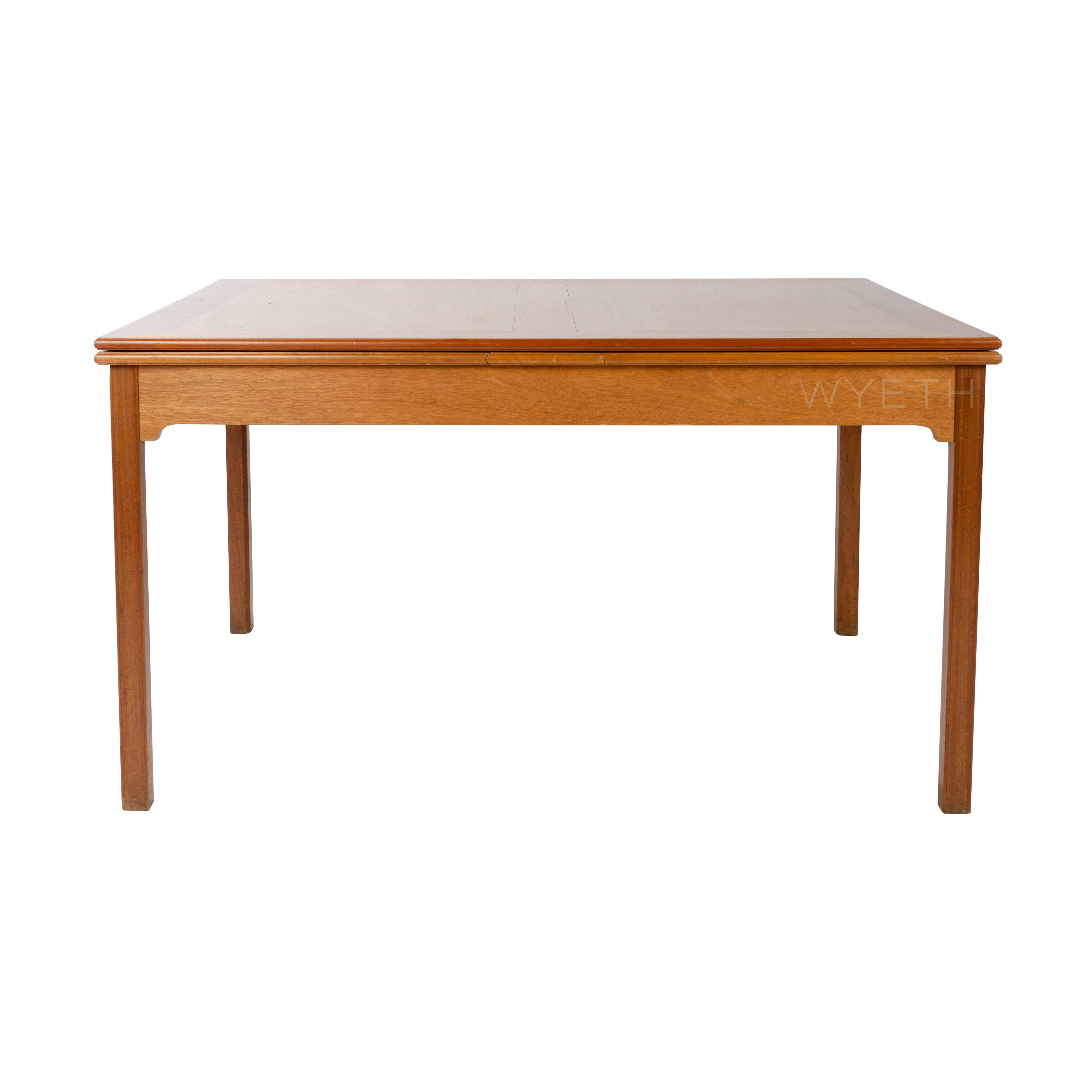 A model 4229 dining table in solid mahogany with two extension leaves.