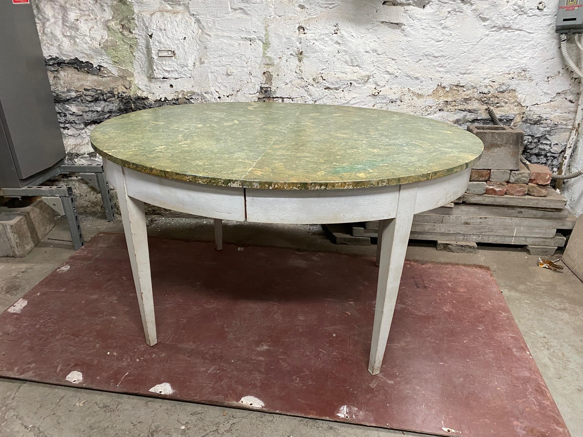 Extending Gustavian style painted wood dining table with faux marble Antico Verde top finish resting on tapered legs. When fully extended 120 inches. There is 3 extensions: 1 x 13.5 inches and 2 x 26 inches.