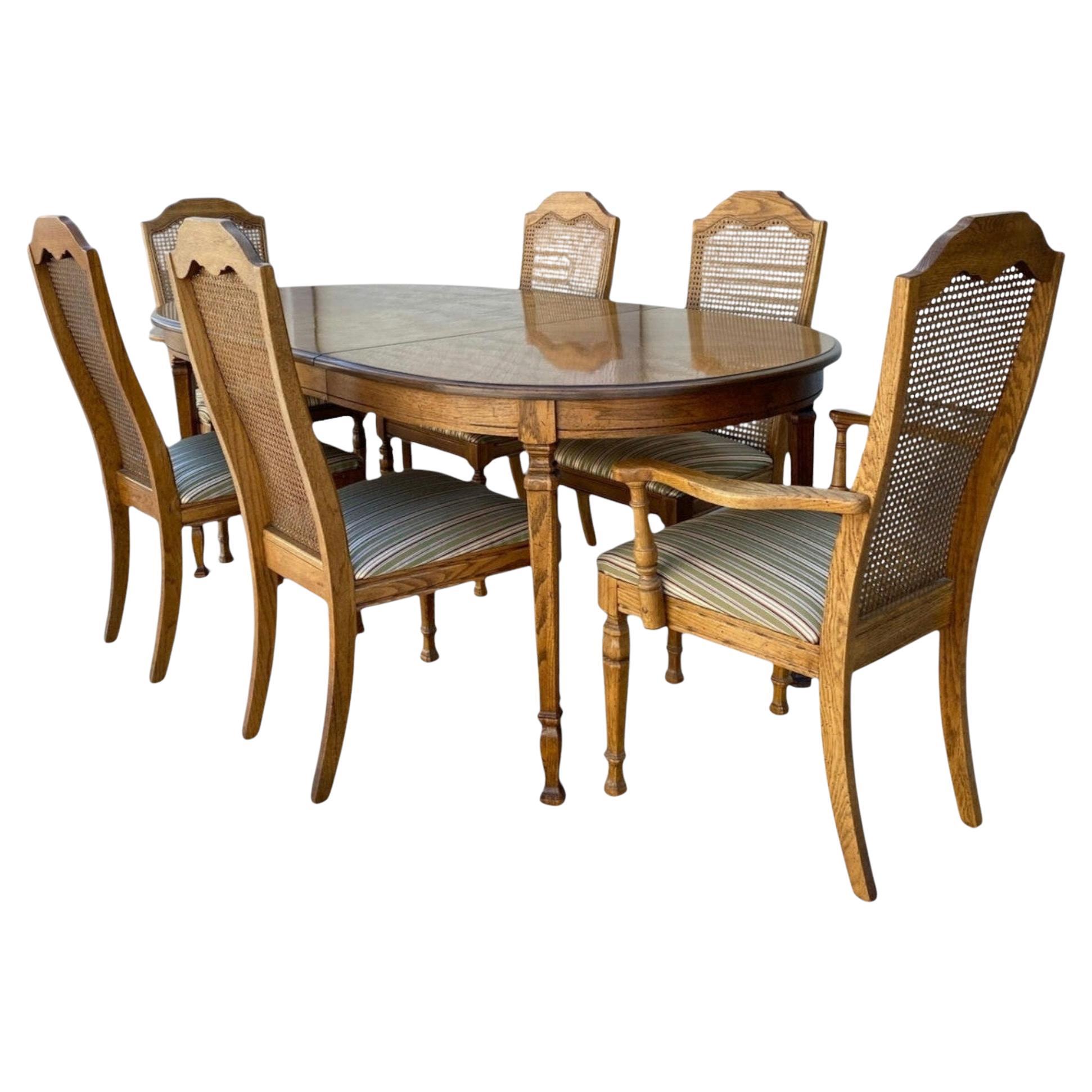 Extending Oak Dining Table and Six Cane-Back Chairs