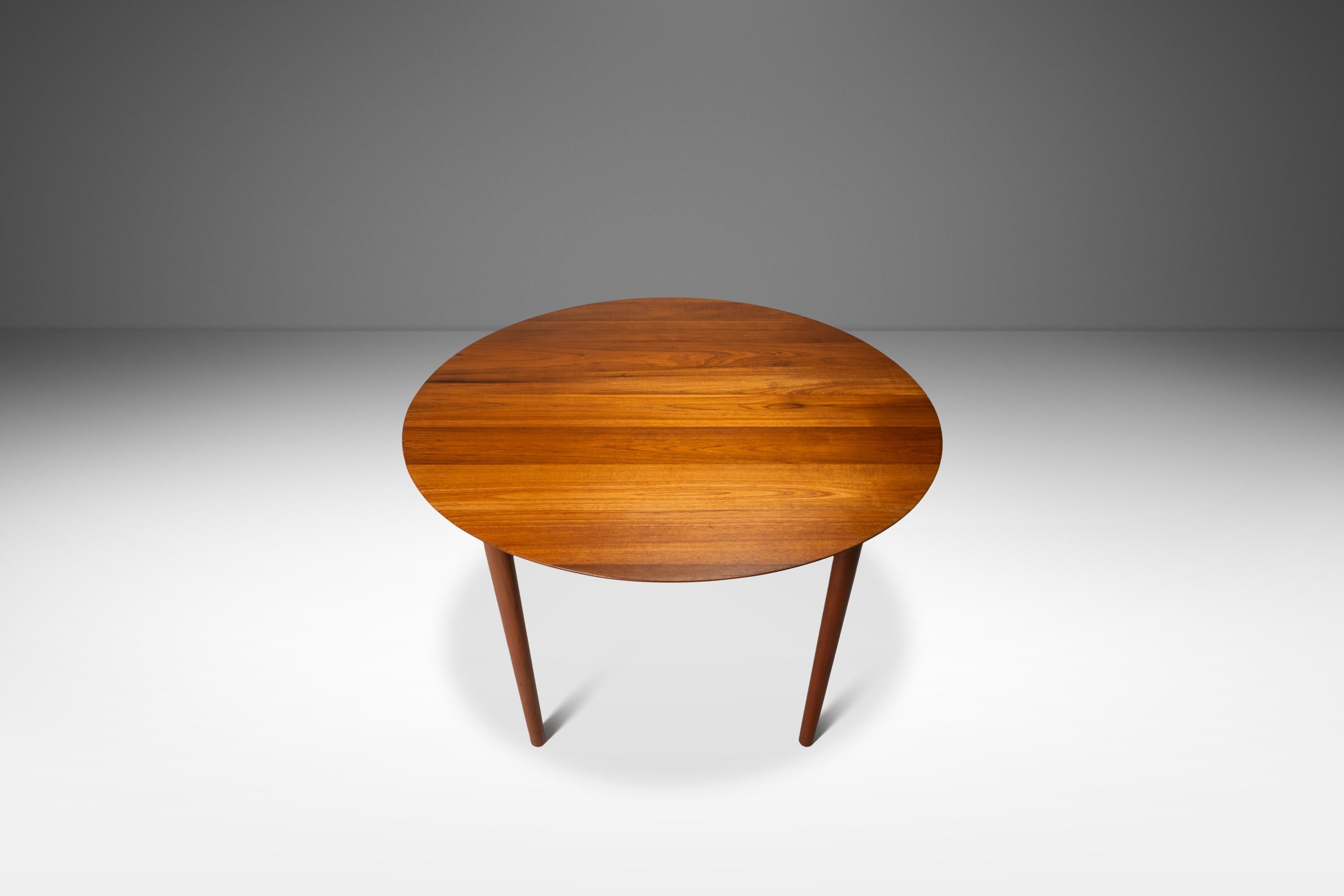 Introducing a in stunning expansion dining table in rare 100% original, vintage condition. Designed by the iconic design duo Peter Hvidt & Orla Mølgaard-Nielsen this artfully crafted table is the epitome of 