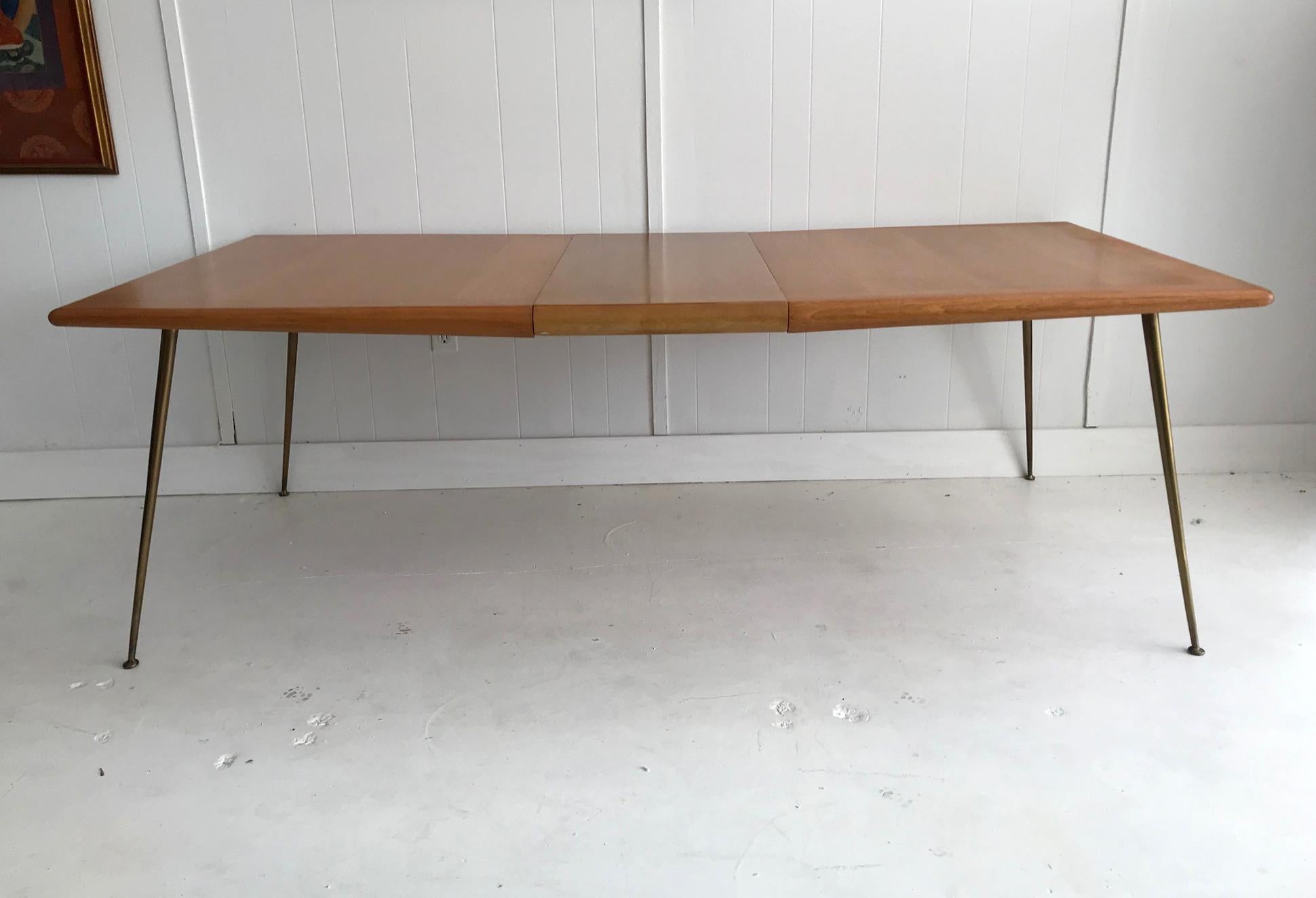 A great looking extension dining table designed by T.H. Robsjohn-Gibbings for Widdicomb. Known as the 