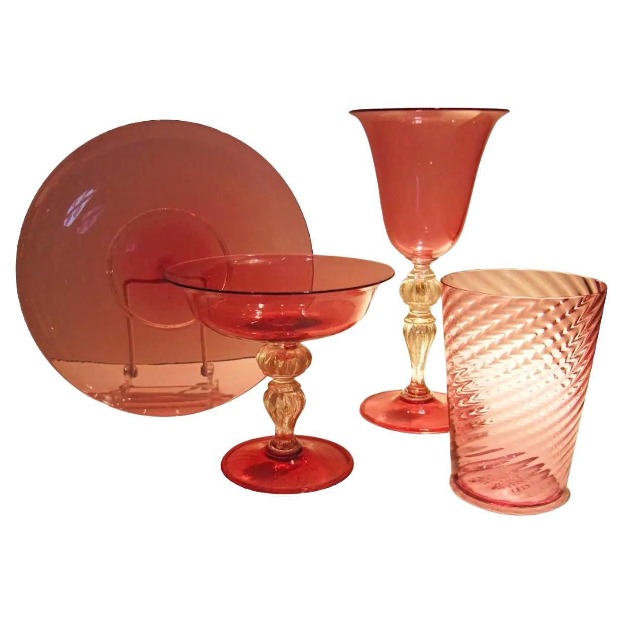 Extensive Collection of Cranberry Venetian Glass Stemware, Plates and Tumblers For Sale