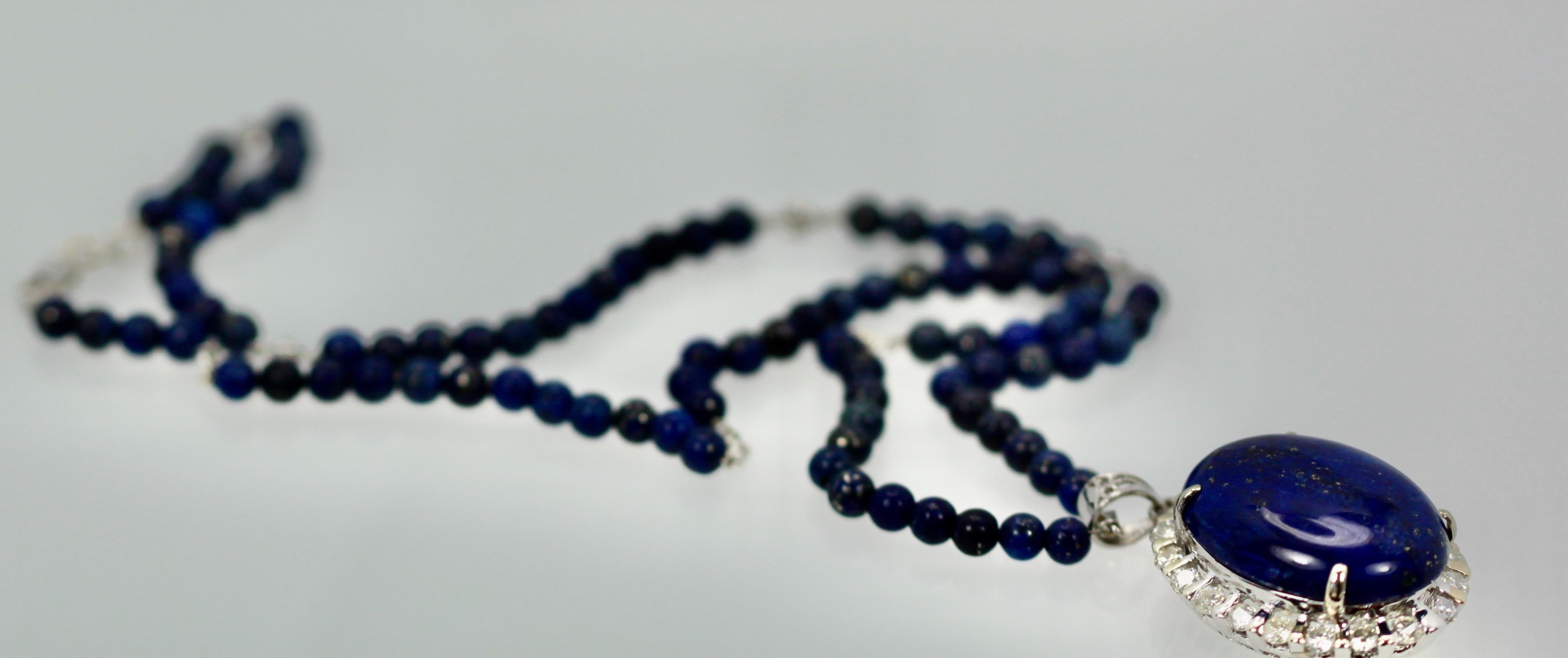 This fine gem quality Lapis Lazuli Pendant is 25mm in a 30mm x 30 mm mount. The Diamonds surrounding the pendant boosts 2.00 carats of Diamonds.  This pendant can be worn on a white gold chain or on this beaded Lapis chain. The Lapis beads are 4.5mm