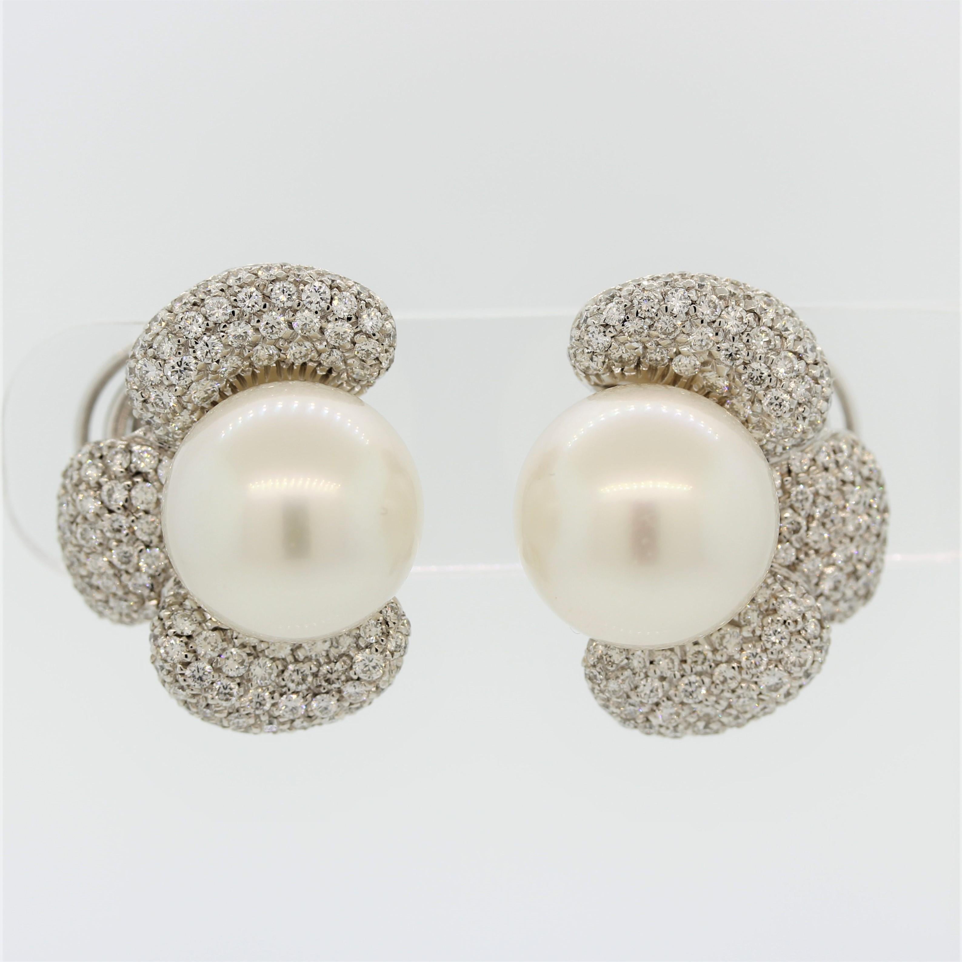 A fantastic and large pair of matching 15mm South Sea pearls feature on these floral earrings. They are perfectly rounded, have excellent luster and a soft rose overtone. Light rolls sweetly across the pearls as they are free of any blemishes. They