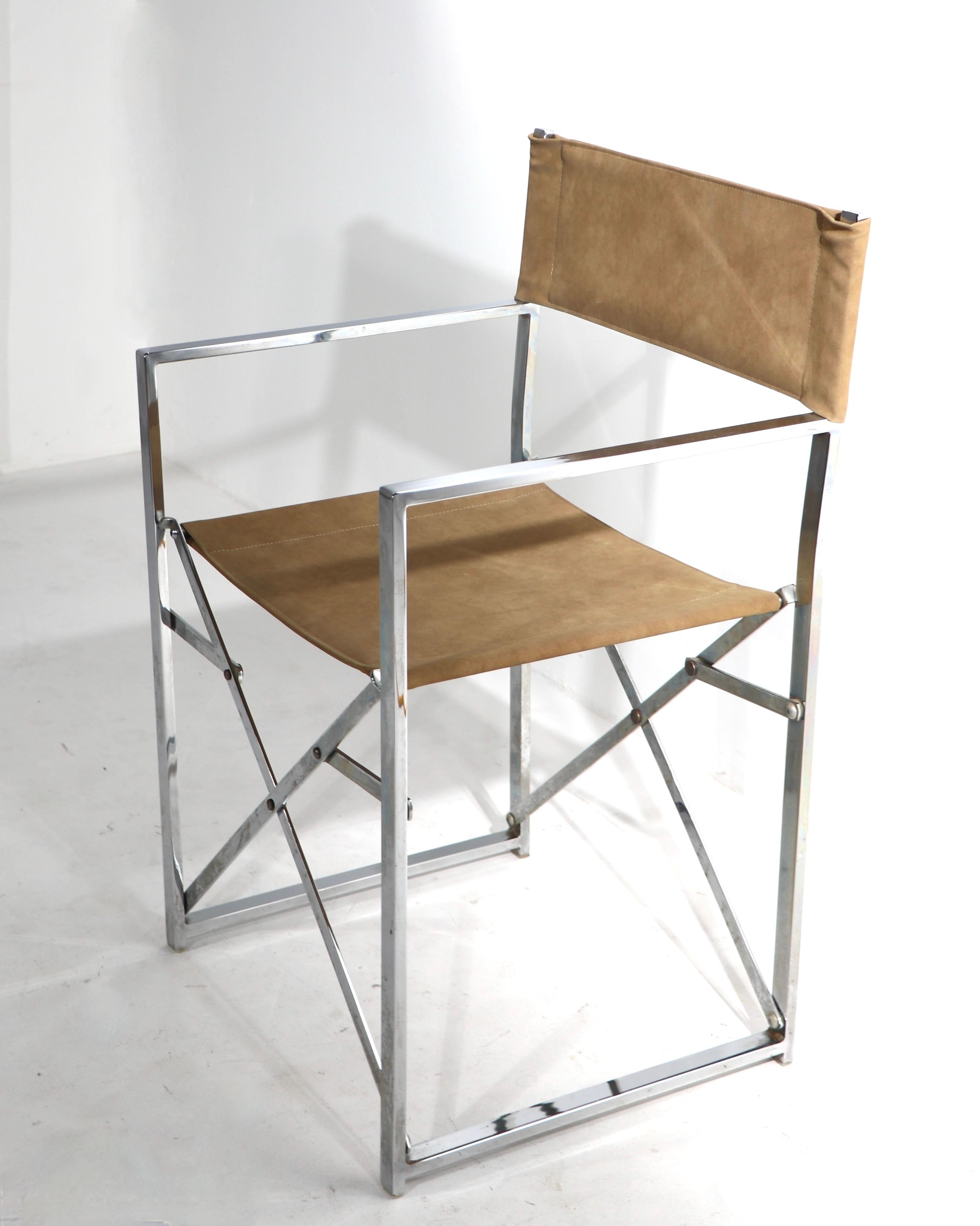 This example is unusually well crafted, having seamless weld construction, extra structural support struts and an ultra suede seat and back. Attributed to Alessandro Albrizzi, in the style of Milo Baughman. Crisp and clean, ready to use condition.