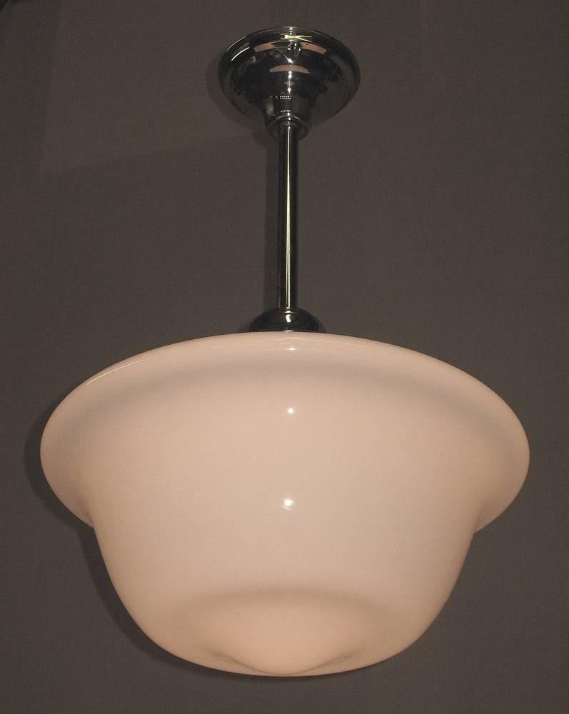 Three available priced each.
With one of the more pleasing profile, this 1920s shade is 16 inches across. Shown on new polished nickel fitters which can be adjusted to your required length.
Can handle up to 250 watts each.