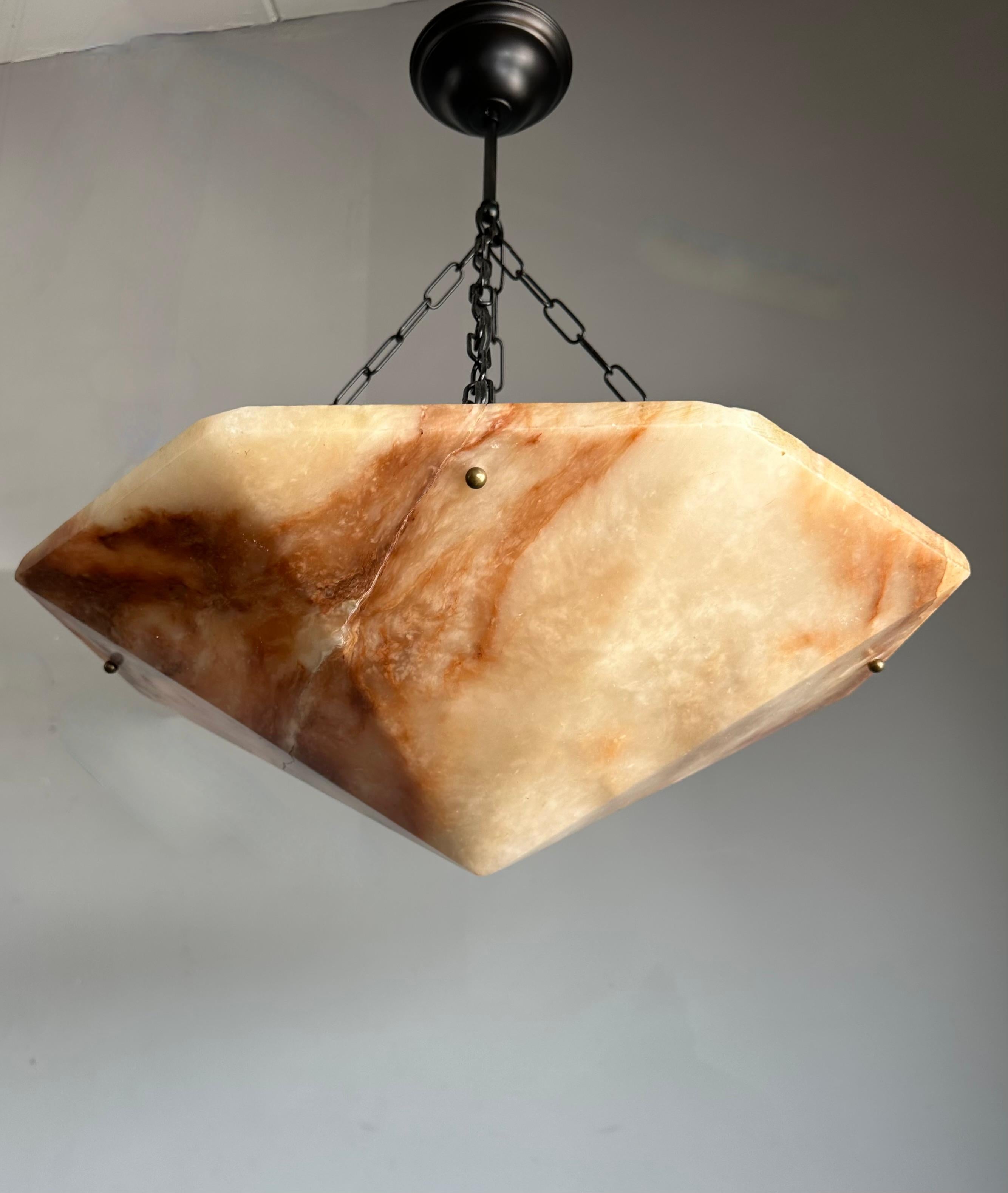 Stunning geometrical Art Deco design alabaster light fixture.

This large size and pure Art Deco pendant from the early 1900s is an absolute joy to come home to. The rare and beautiful, diamond shape alabaster shade is perfectly complemented by the