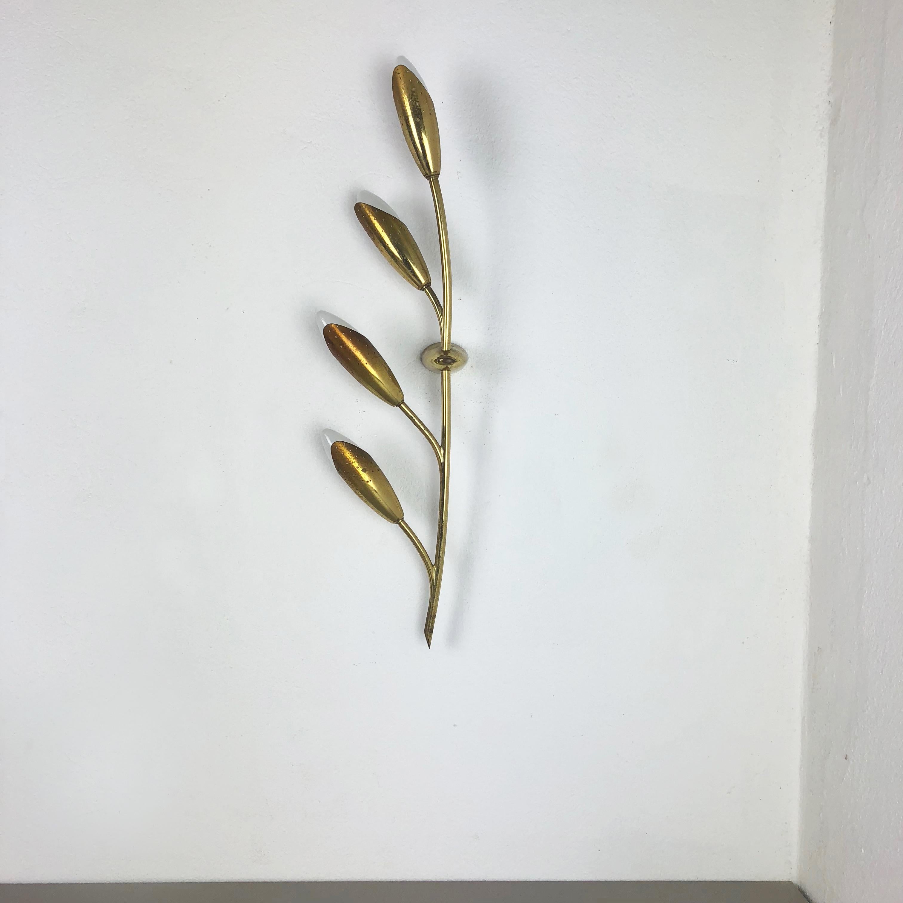 Article:

Brass wall light


Producer:

Origin France


Age:

1950s



This modernist wall light was produced in France in the 1950s. It is made from solid metal with brass tone finish. Super rare theatre wall light with four floral