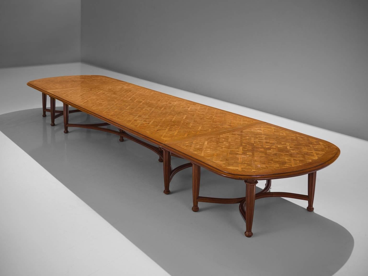 Extra large dining or conference table in oak, France, 1920s. 

This large Art Deco table has been executed with a lovely graphical wooden inlay on top. This conference table was custom-made in France in the 1920. It shows perfect craftsmanship, as