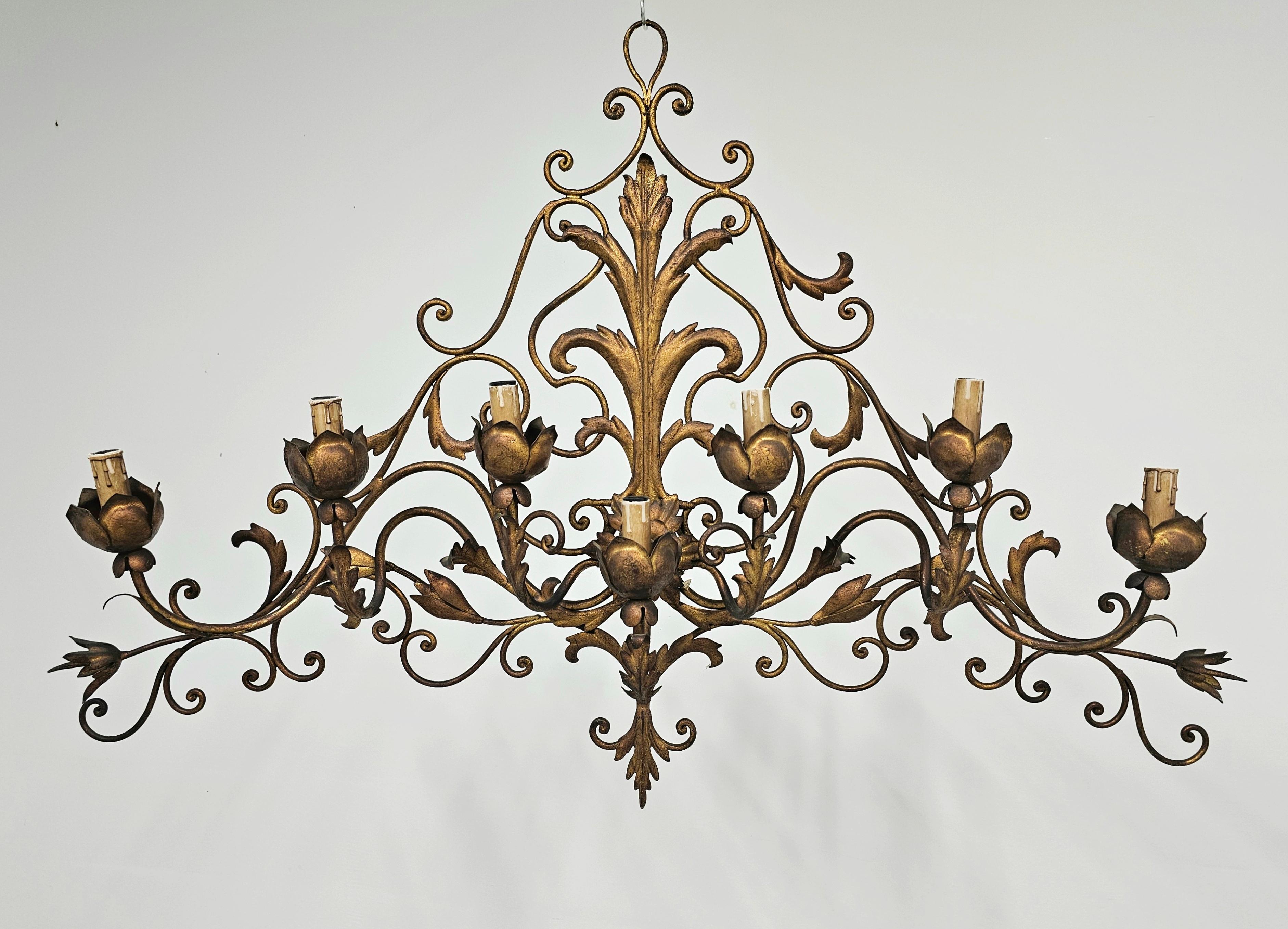 In this listing you will find a spectacular extra large 7-arm sconce done in gilt metal. This huge Wall Sconce was manufactured by Palladio, and it is featuring acanthus leaf as a main motif and 7 lamp-holders hidden inside the flower buds. Made in