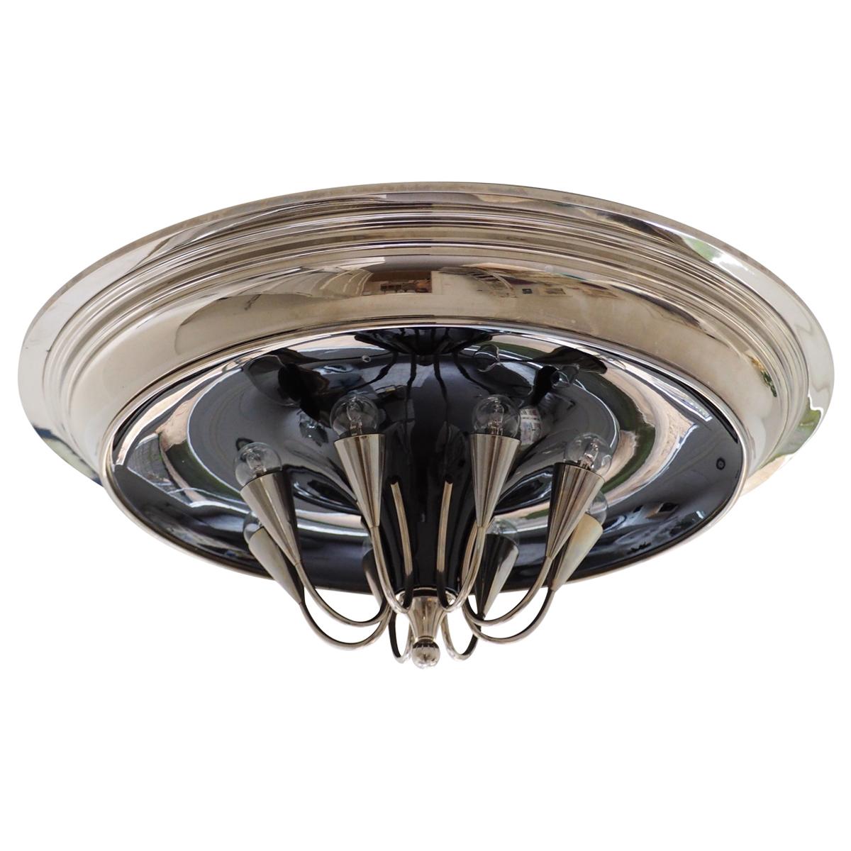 A beautiful huge Art Deco Style flush mount, Austria, circa 1970- 1990s.
This spectacular  light fixture is made of nickeled and black lacquered brass.
Diameter : 31.49 inches.
Socket: 8 x E27 or E26 for standard  screw bulbs.

