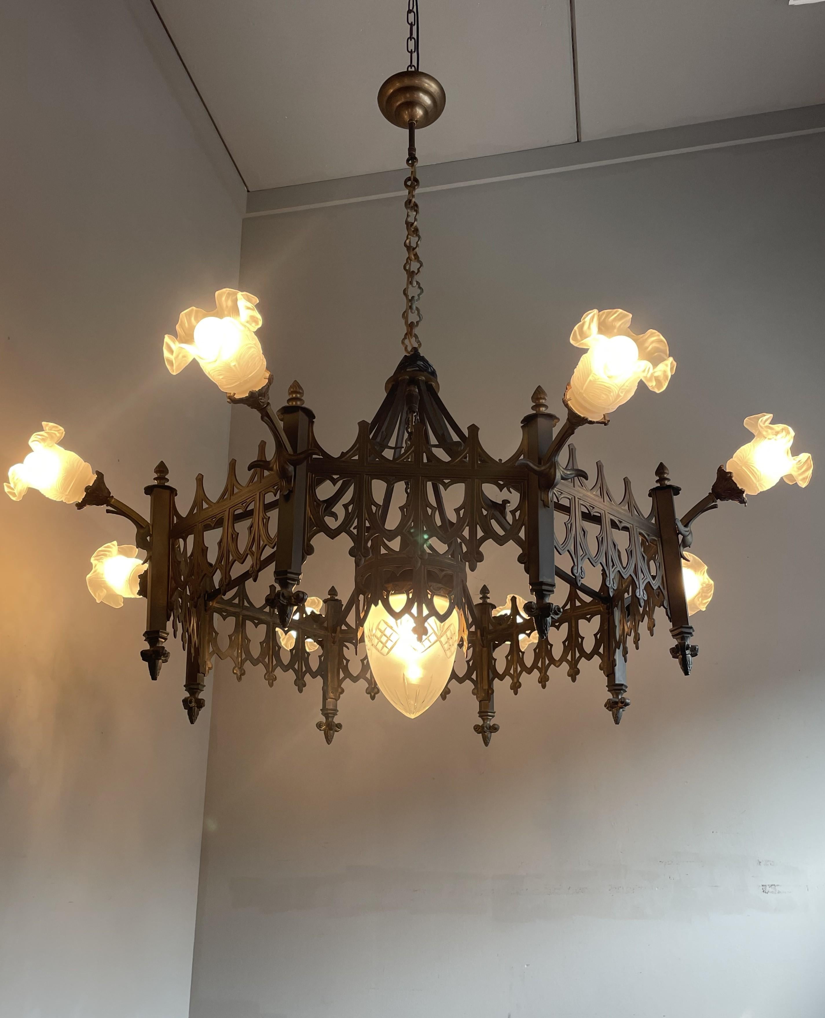 Rare size, Gothic Revival, octagonal design chandelier with 9 glass shades.

With early 1900s lighting as one of our specialities we can tell you that you will hardly ever come accross a Gothic chandelier that is as large and impressive as this