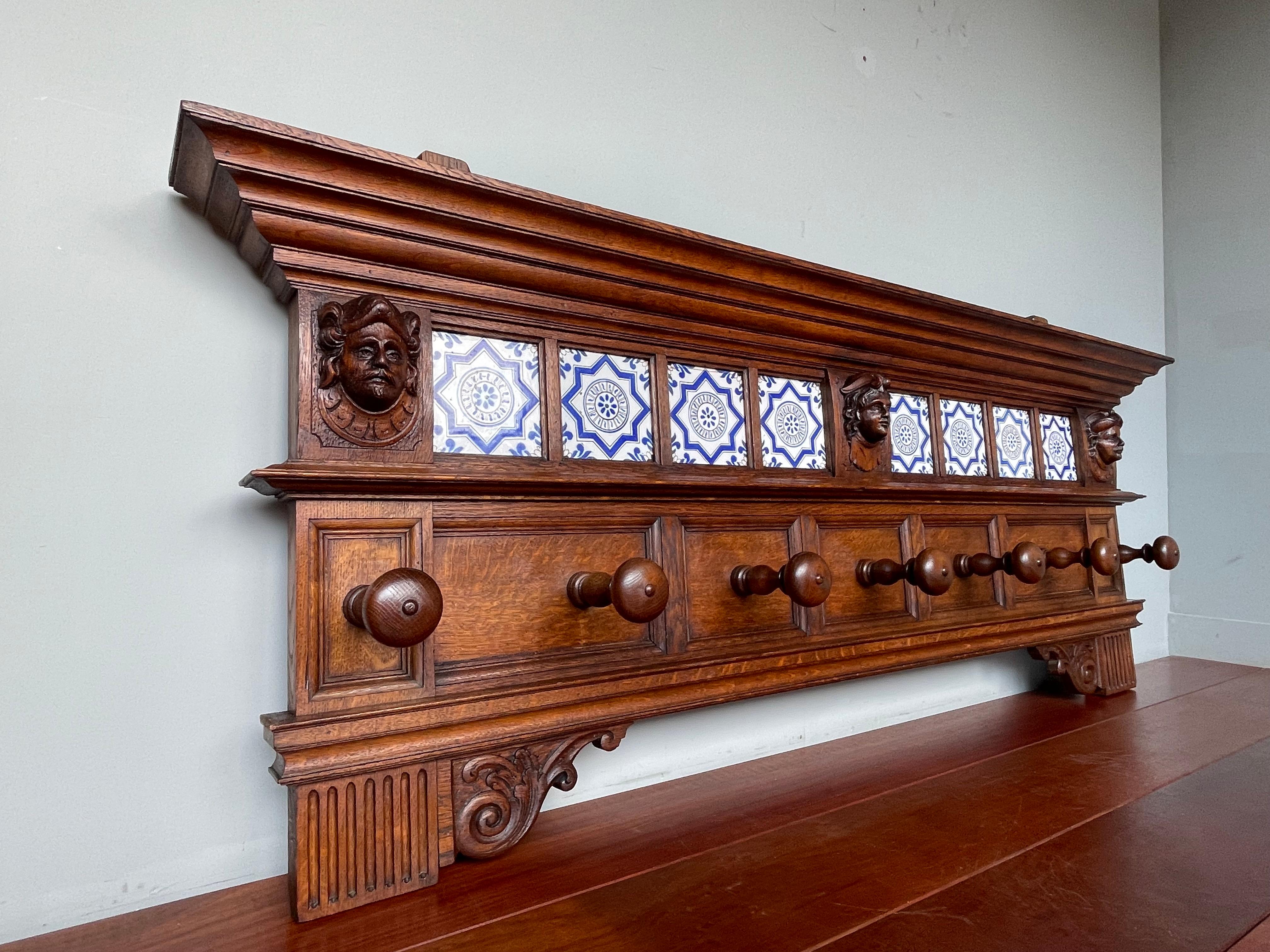 One of the largest ever, impressive and meaningful wall coat racks. Almost 5.5 feet wide. 

If you are a collector of unique and rare size antiques then this early 1800s, Renaissance Revival, solid tiger oak wall coat rack could be perfect for you.