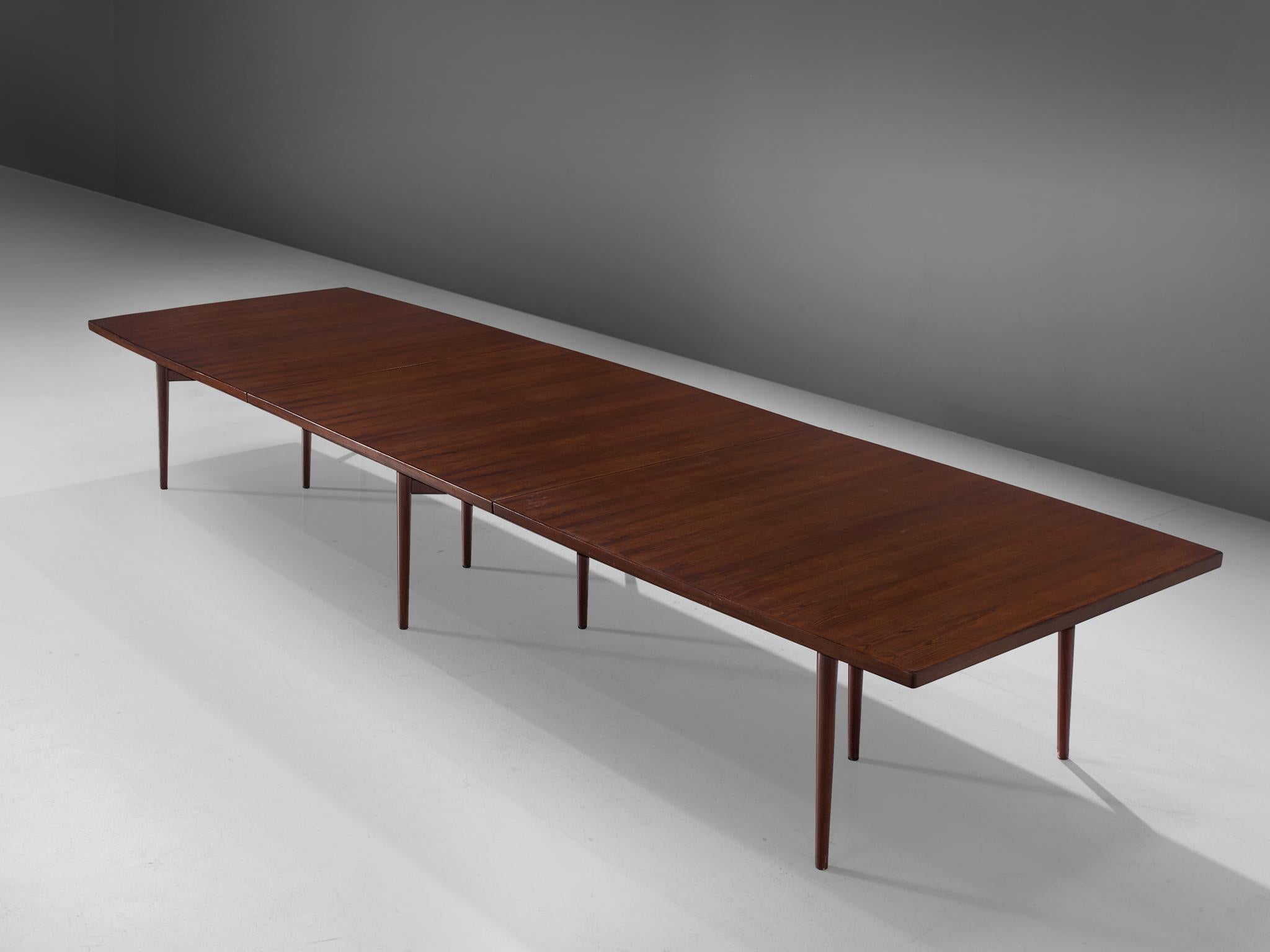 Arne Vodder for Sibast Furniture, rosewood, dining table, Denmark, 1960s.

This dining table or conference table is executed with rosewood veneer. The straight top that is made out of three pieces is supported with a sculptural frame that has