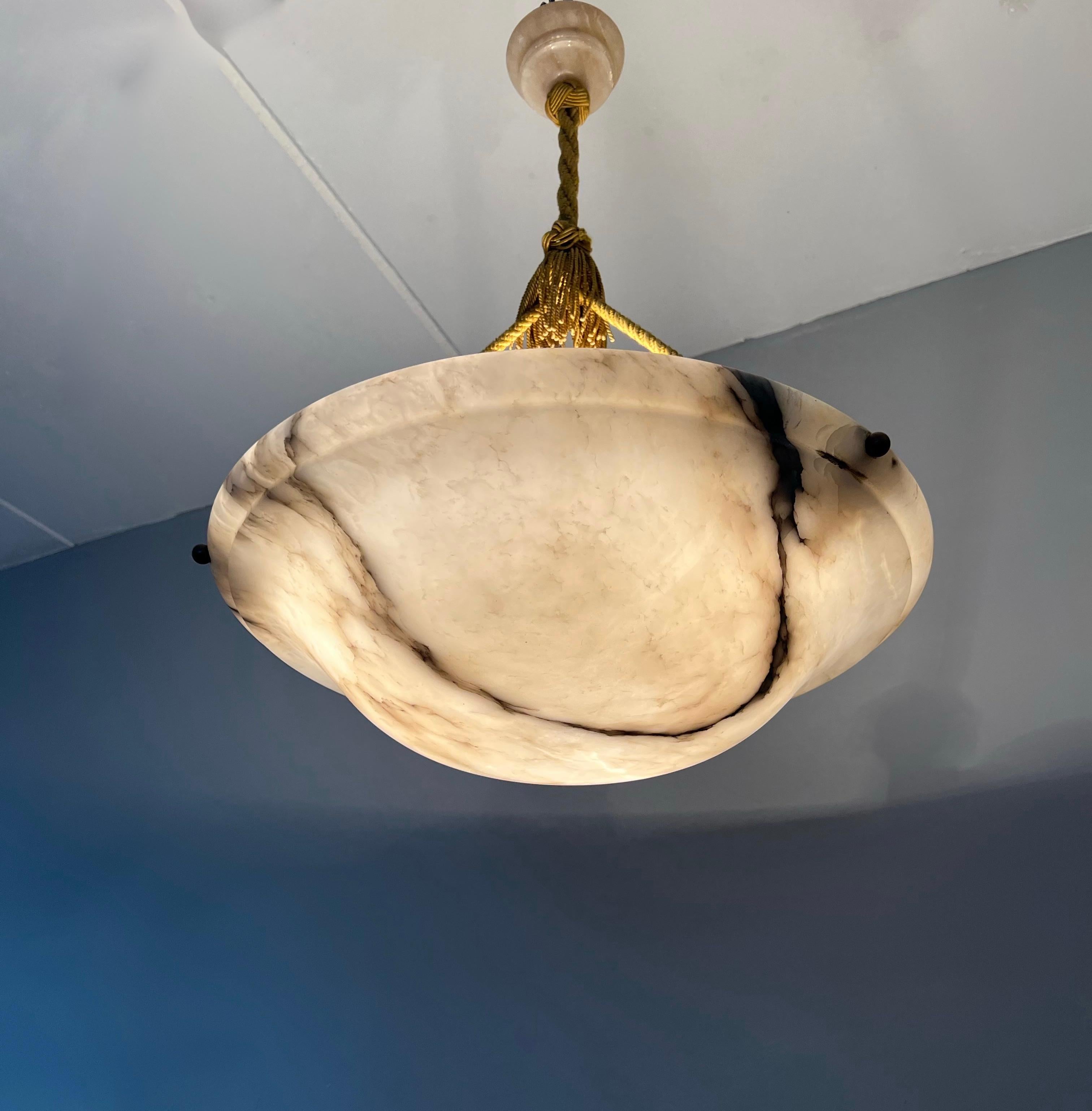 Top class antique pendant with a striking alabaster shade of 21.8 inches in diameter.

Thanks to its large size and excellent condition this timeless alabaster chandelier is bound to light up someones days and evenings soon. Because of their natural