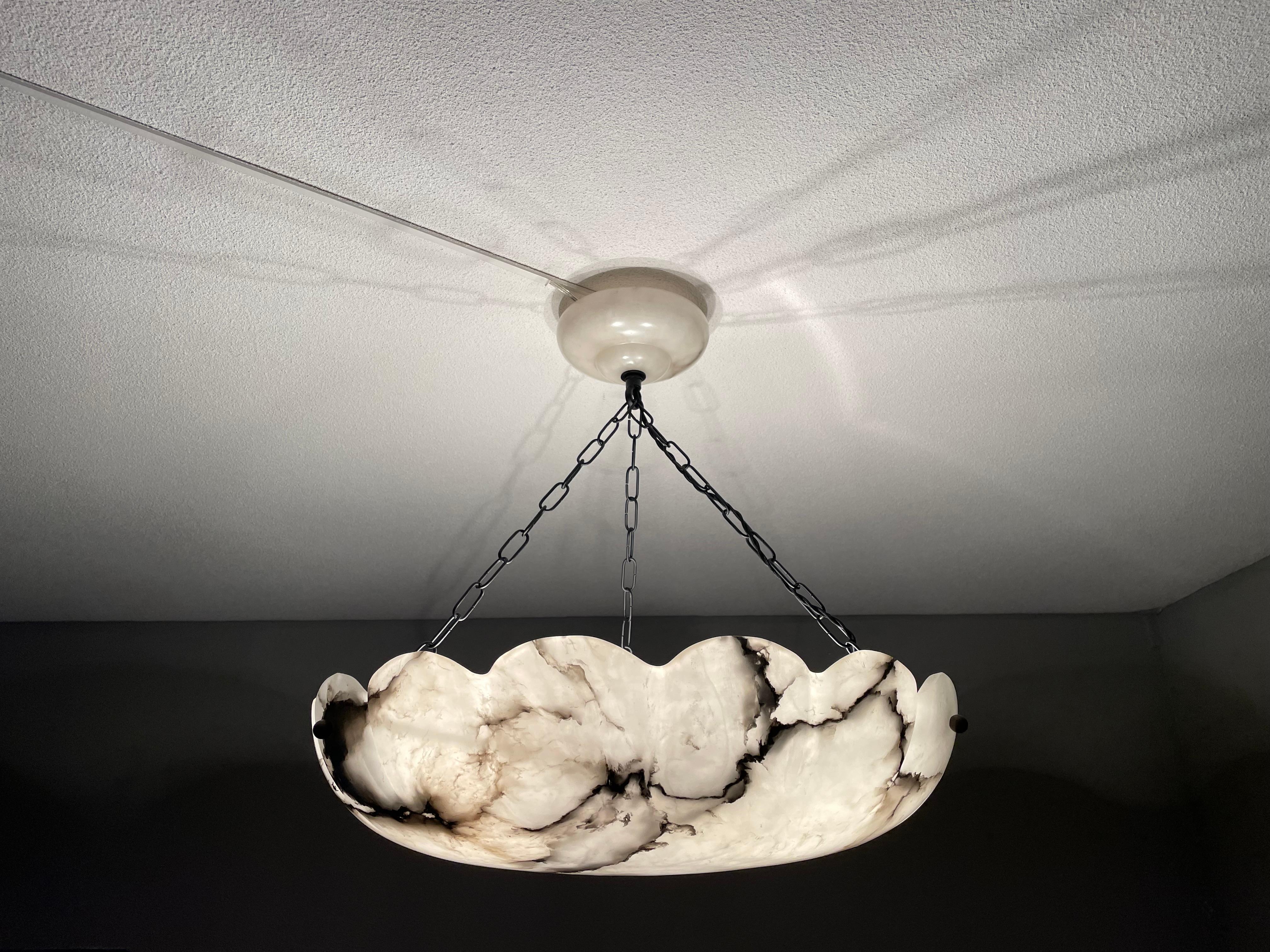 Top class, three-light chandelier with a rare size and great design alabaster shade.

Thanks to its extra large size, excellent condition and timeless design this alabaster pendant or flush mount is the perfect lighting solution for many types of