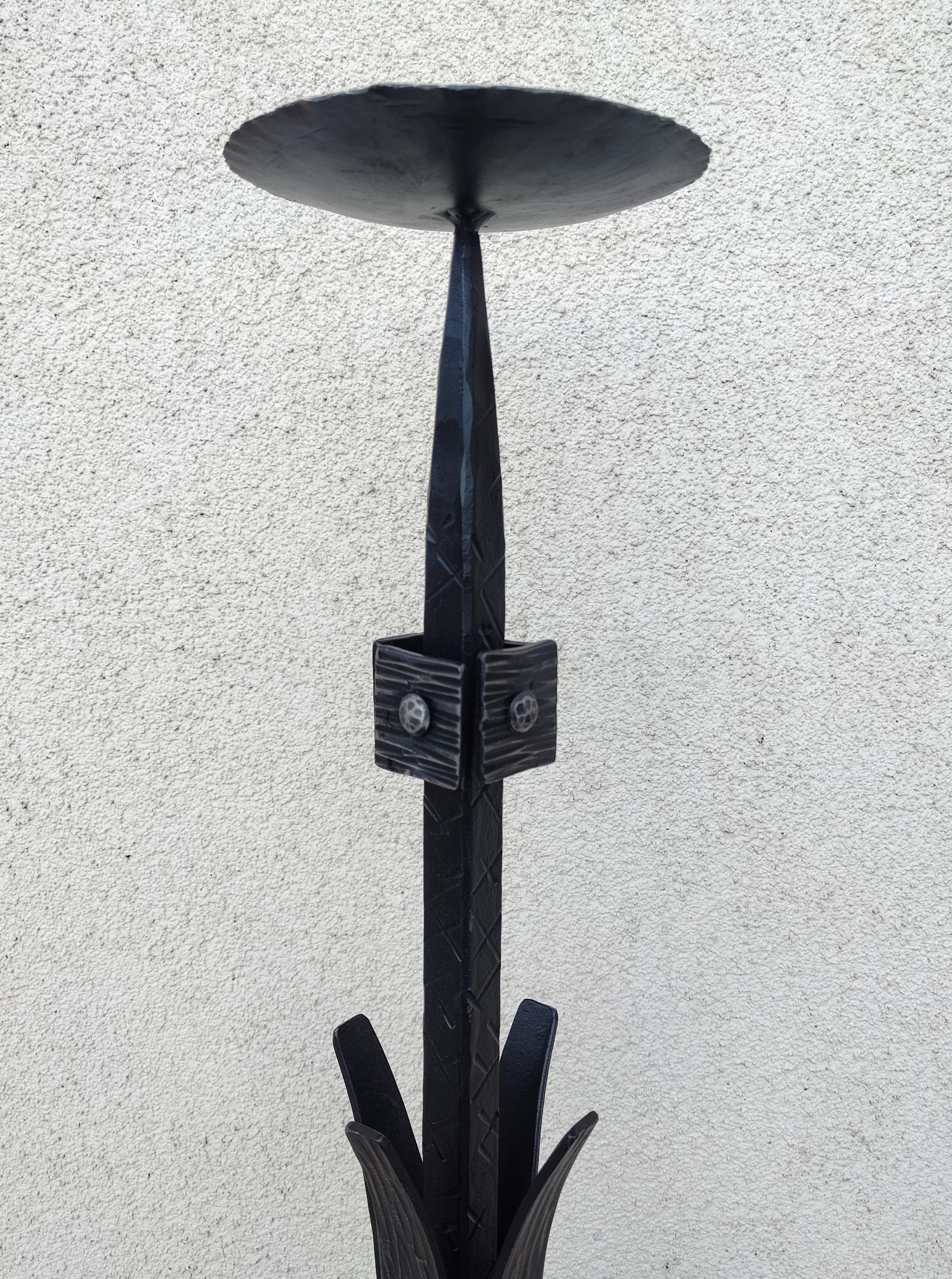 In this listing you will find an extra large brutalist candlestick holder done in Wrought Iron. It features a single candle stand and a very impressive, powerful design. This piece is handmade. Made in Western Germany in 1970s.

Very good vintage