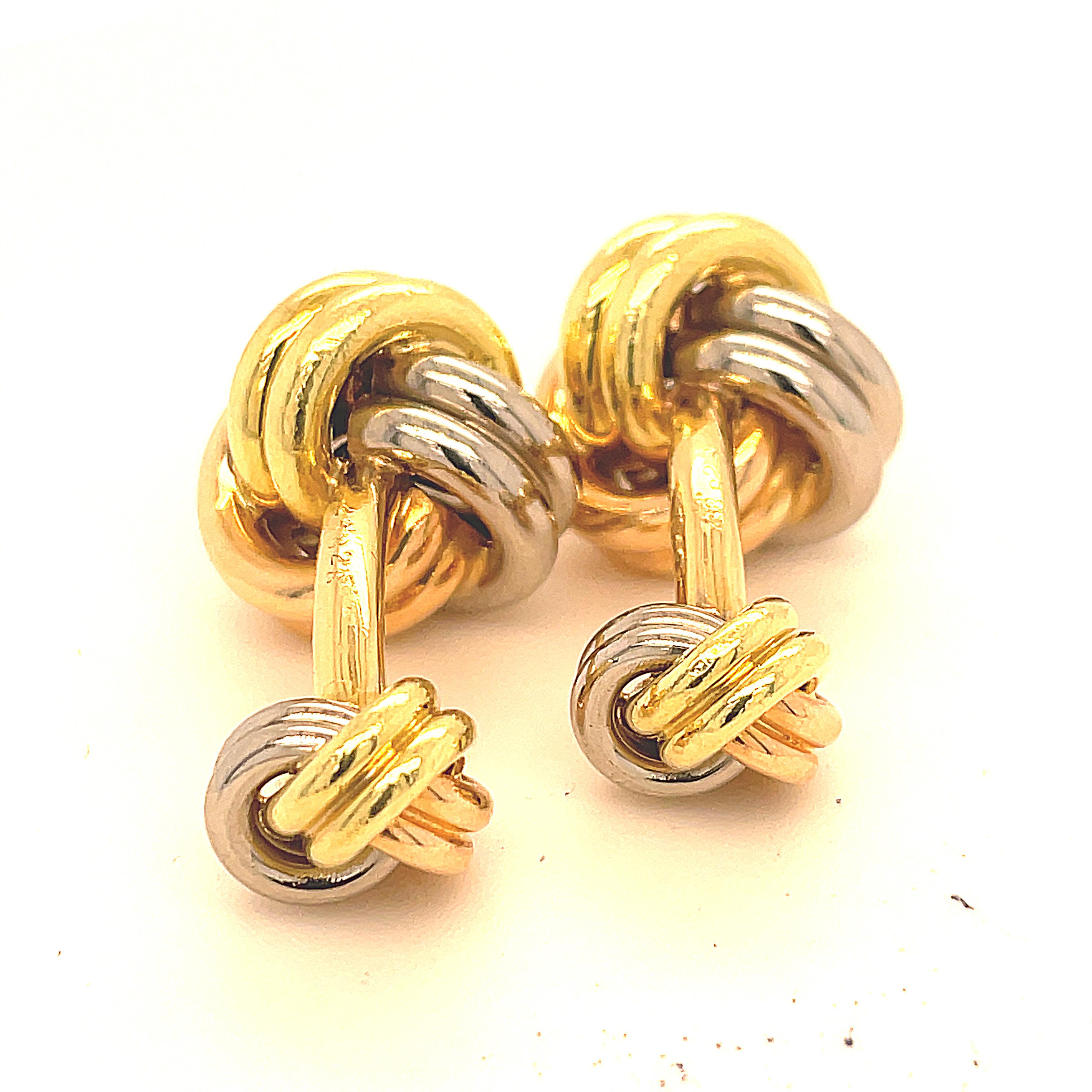 Super size Trinity knot cufflinks.  Made, signed and numbered by CARTIER.   Rose, yellow and white 18K gold.  Large knot in front and smaller knot on the reverse.  
2/3