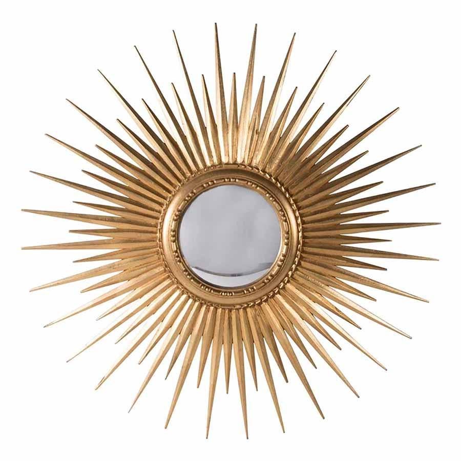 This striking extra large sunburst mirror is made from carved wood finished in a golden color. The convex mirror is framed by a beautifully carved frame, from which the sunbursts emerge.
 