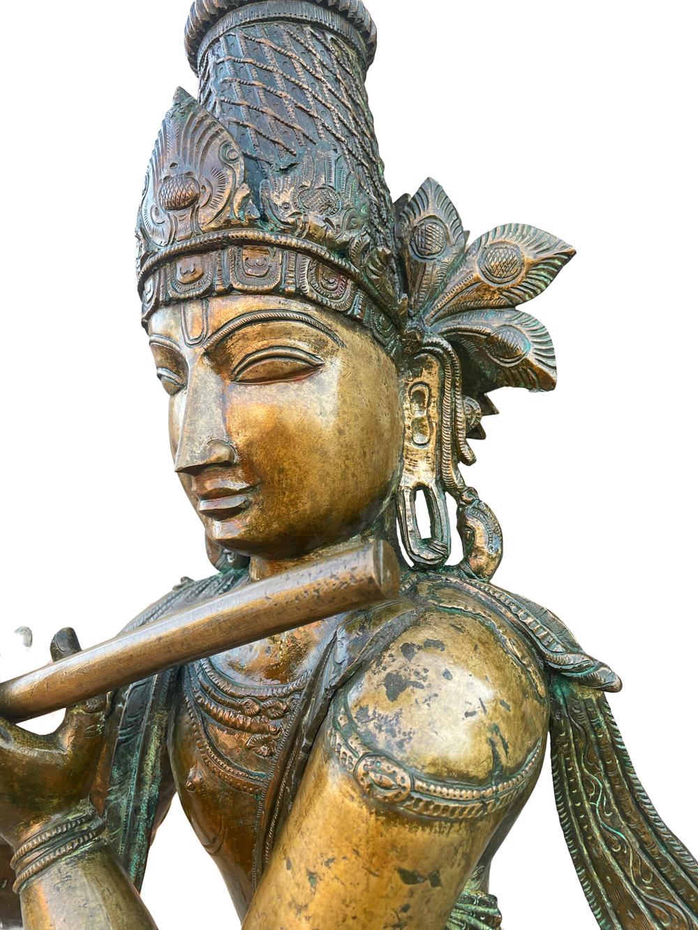 This statue stands over 4 feet tall and made of heavy cast bronze. Asian origin from late 19th century. Beautiful warm overall patina.