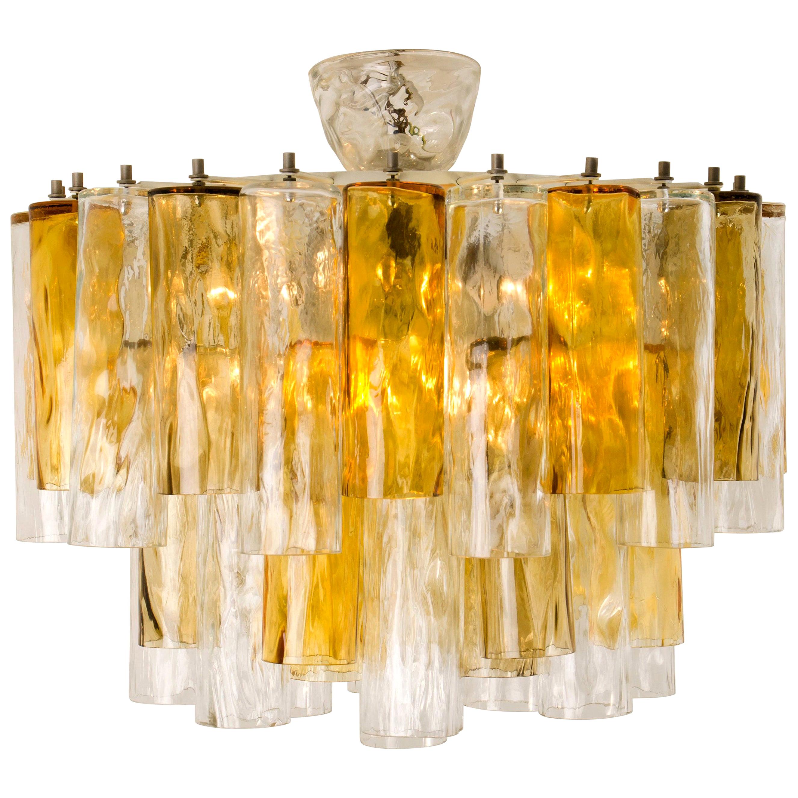 Wonderful and rare version of an extra large midcentury Barovier & Toso Murano glass chandelier. This chandelier is executed to a very high standard. The light features a metal frame with. Stunning light and darker ocher/orange and clear Murano