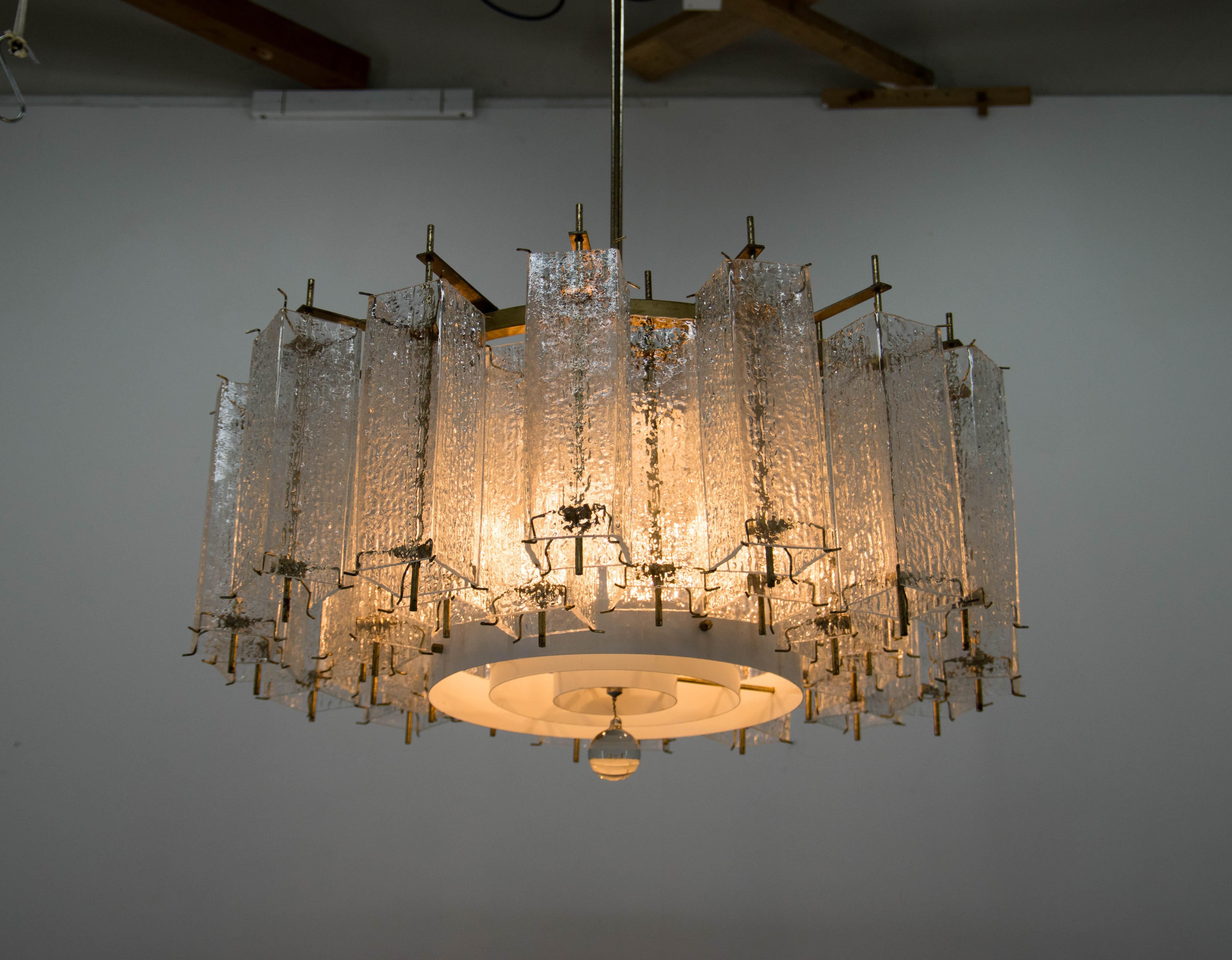Large and heavy brutalist chandelier by Kamenicky Senov.
Two pieces available.
Cleaned, rewired: two separate circuits - 3+3 x 60 W, E25-E27 bulbs
glass in perfect condition
brass with age patina
US wiring compatible.
Shipping quote on request.