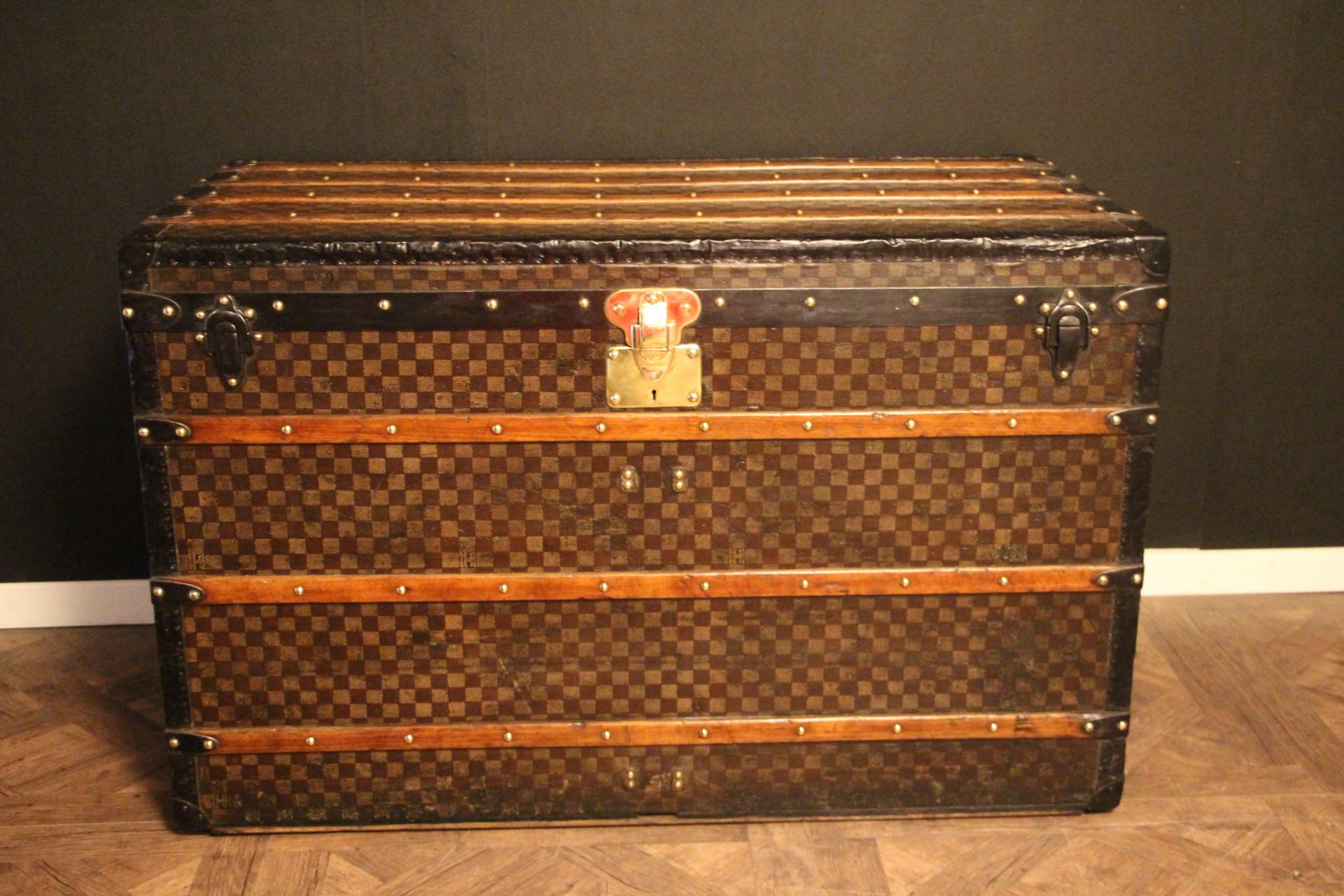 This extra large Louis Vuitton features the very sought after checkers pattern.In some of the checkers, it is written 